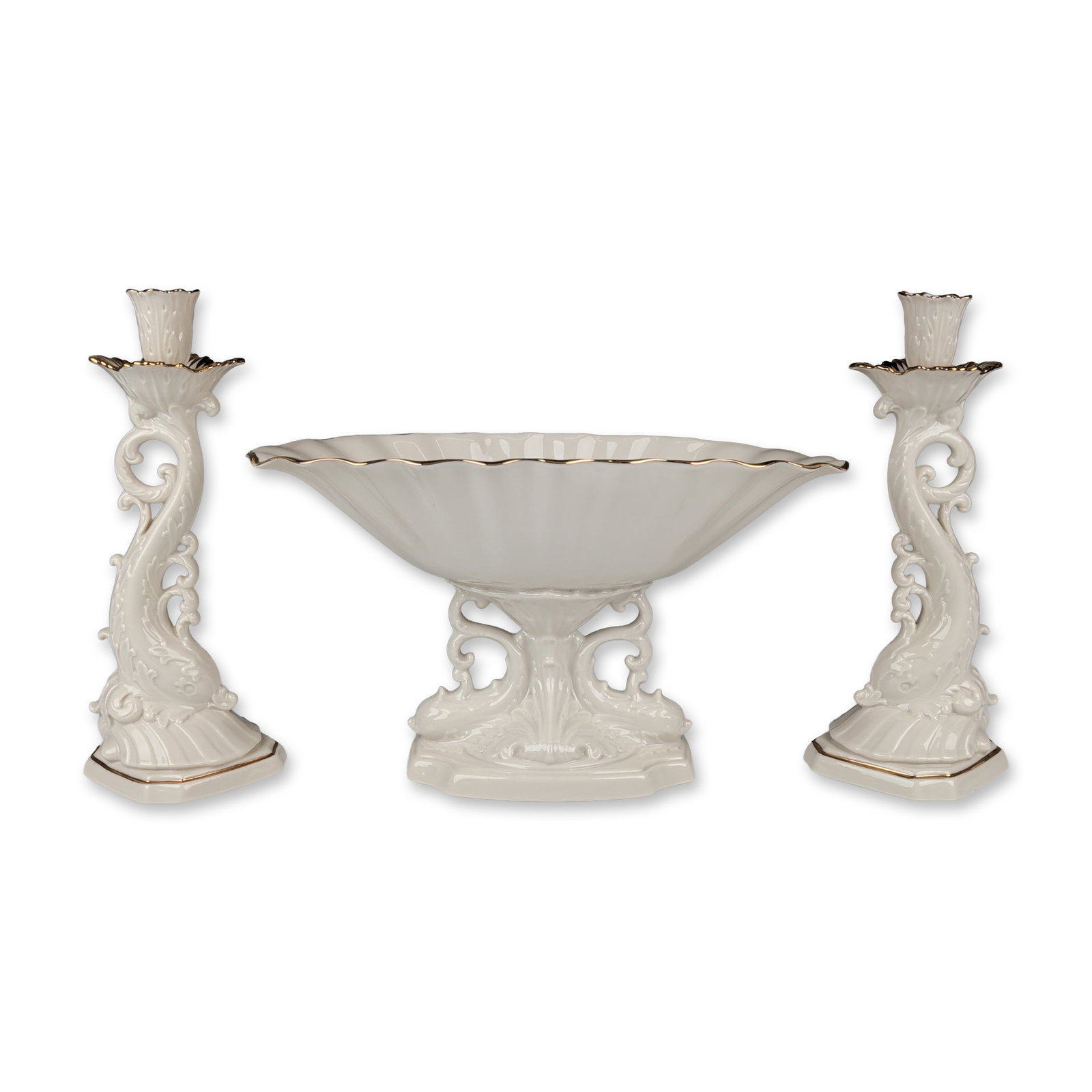 3pc Lenox Legacy Edition Porcelain Aquarius Centerpiece and Dolphin Candlesticks: A set of three porcelain items with gold-trimmed accents from the Lenox Legacy Edition collection. The set includes an Aquarius centerpiece bowl with fluted sides and a pedestal base featuring molded