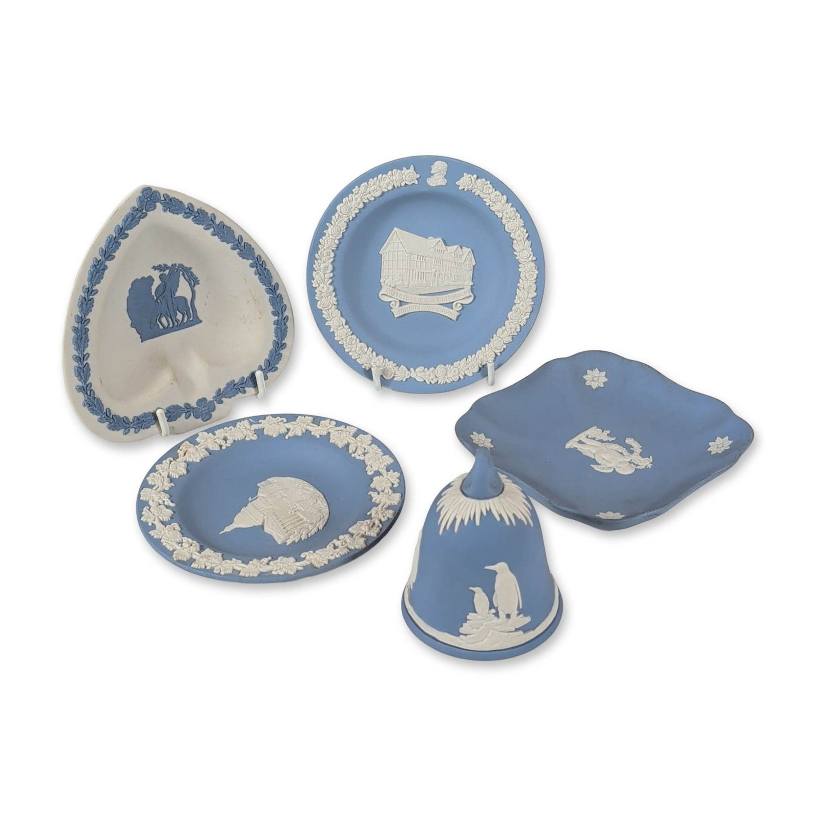 5pc Wedgwood Jasperware Blue and White Ring Dishes: Wedgwood, England. Collection of jasperware decorative objects in traditional light blue with white bas-relief decoration, and one heart-shaped dish in a cream-colored ground with blue relief. The gro