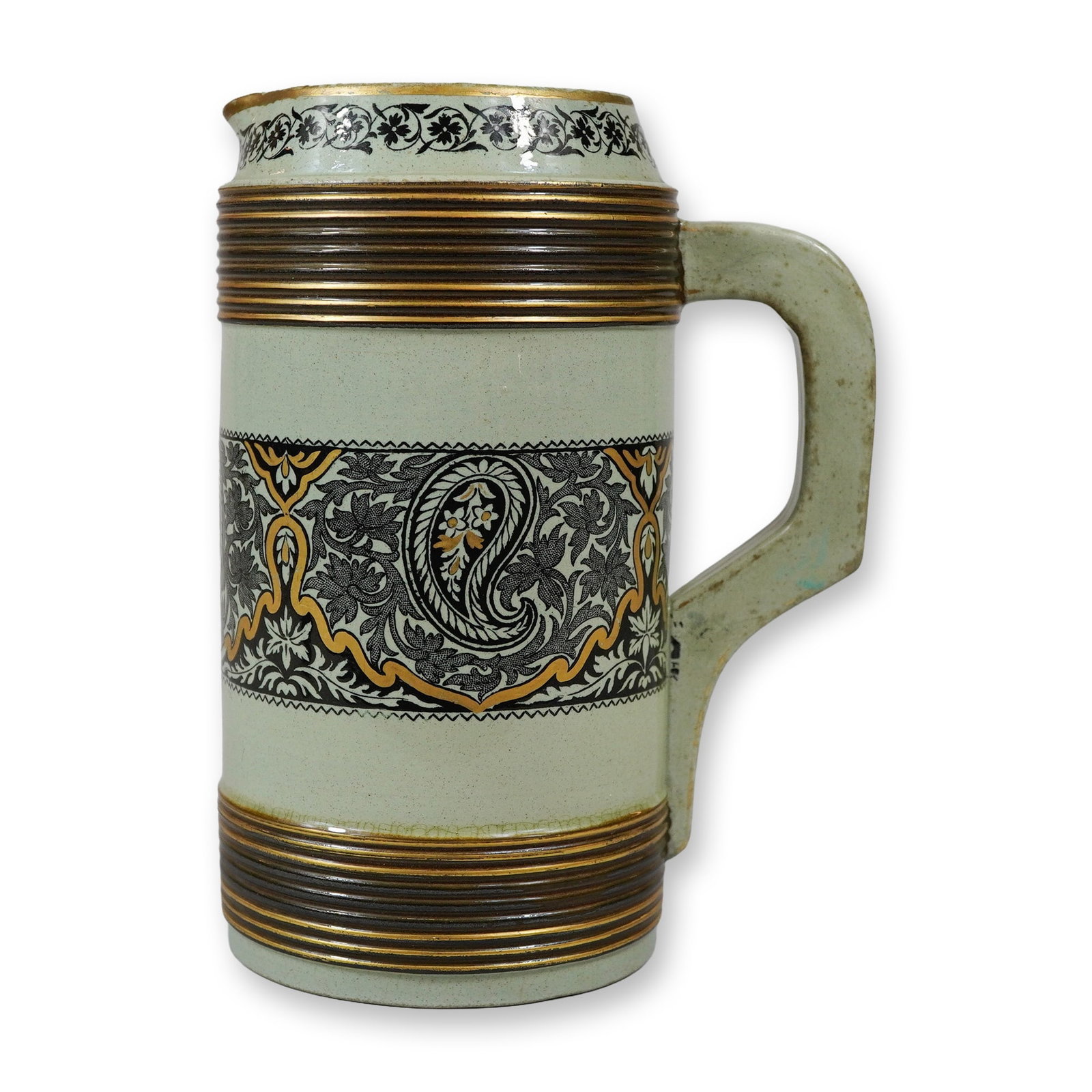 Wedgwood Aesthetic Movement Arabesque Transferware Pitcher: This Wedgwood earthenware pitcher features the Aesthetic Arabesque pattern, a design reflective of the late 19th-century Aesthetic Movement and its interest in Orientalist motifs. The vessel is cylind