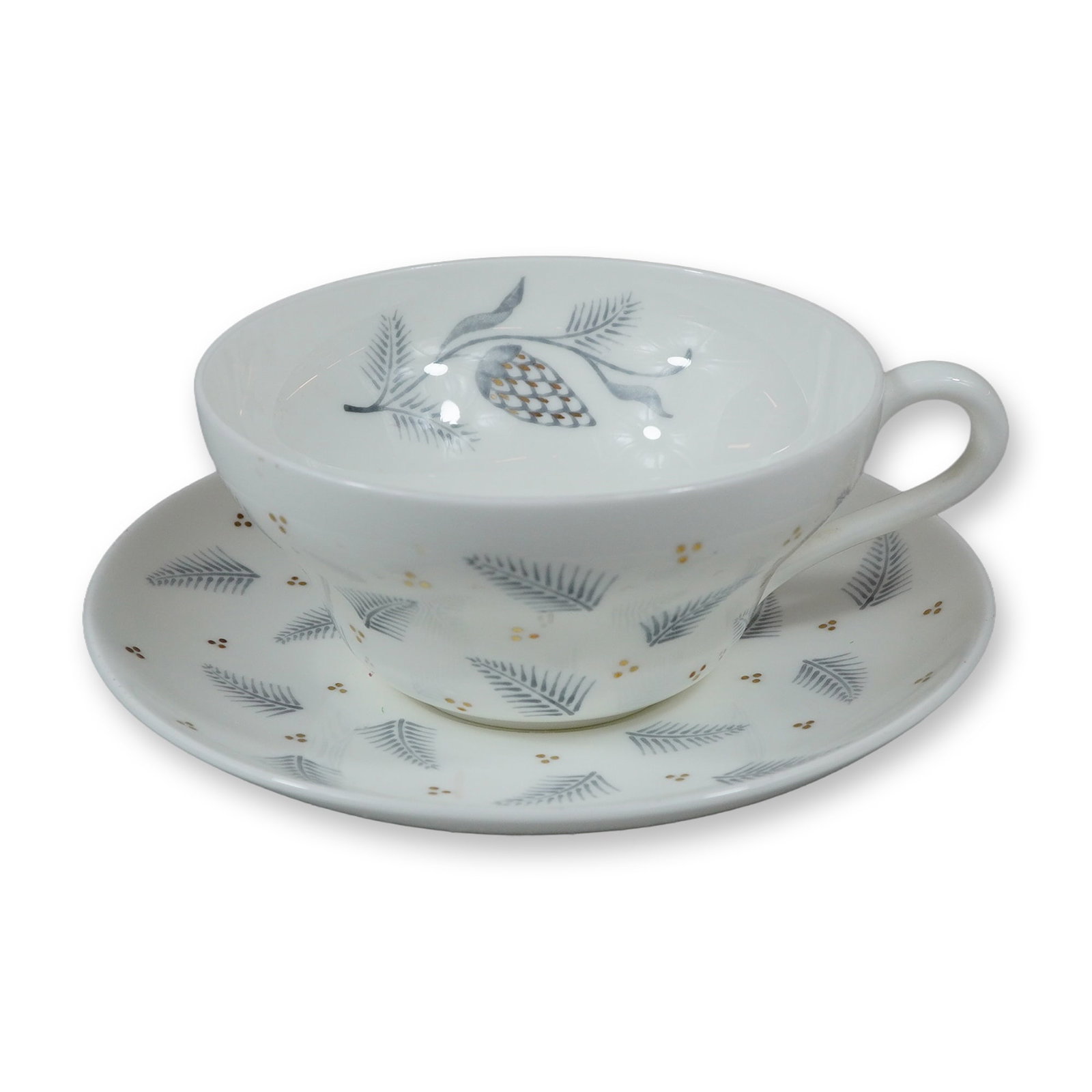 Wedgwood Pinehurst Pattern W4165 Bone China Cup and Saucer: This lot consists of a Wedgwood bone china cup and saucer in the Pinehurst pattern, identified by the pattern number W4165. The set is crafted from white bone china and features a wide, low-profile cu