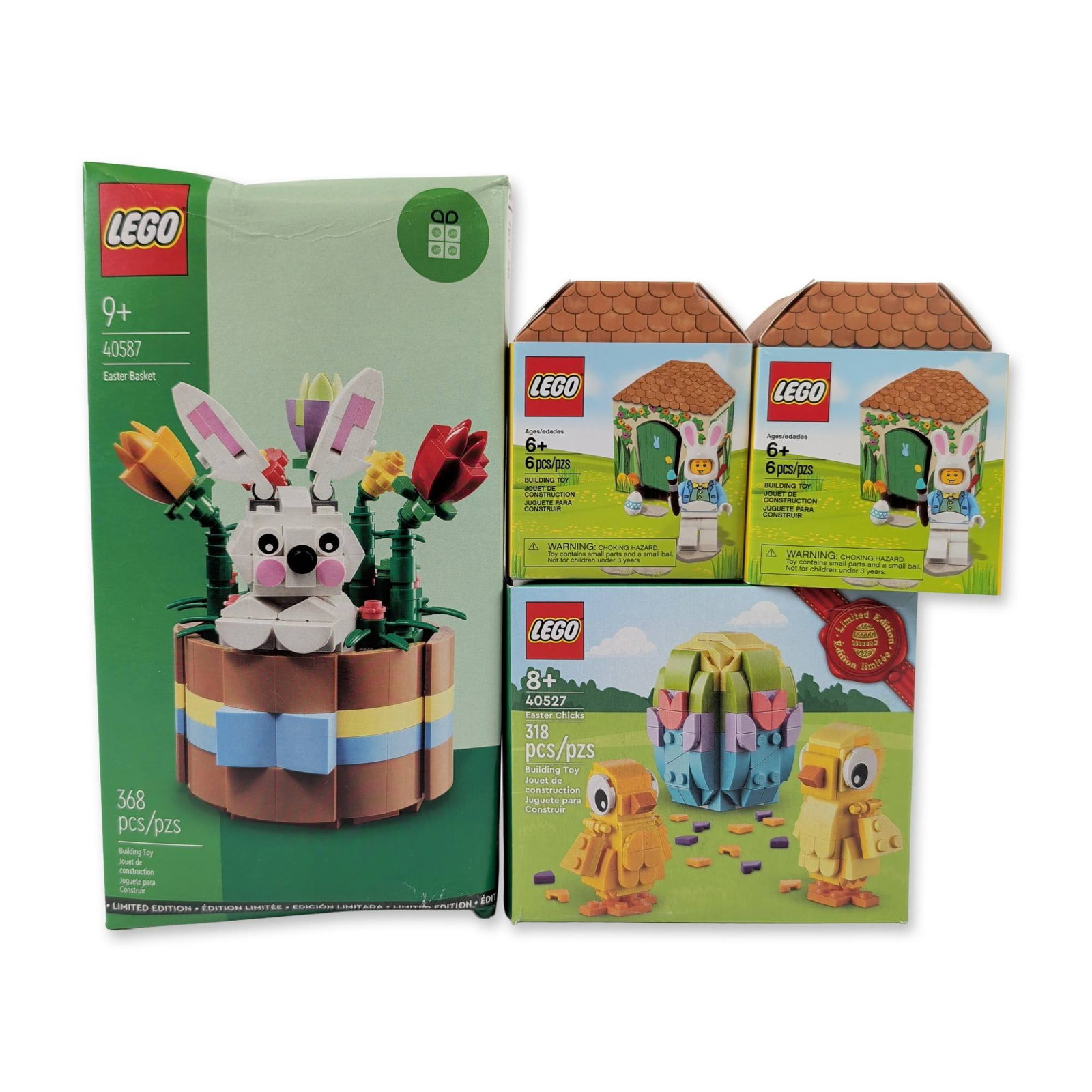 Collection of Four LEGO Easter Building Sets: The LEGO Group. Group of four seasonal plastic construction sets featuring Easter holiday themes. Includes Easter Basket set 40587, Easter Chicks set 40527, and two Easter Bunny House sets 5005249. It