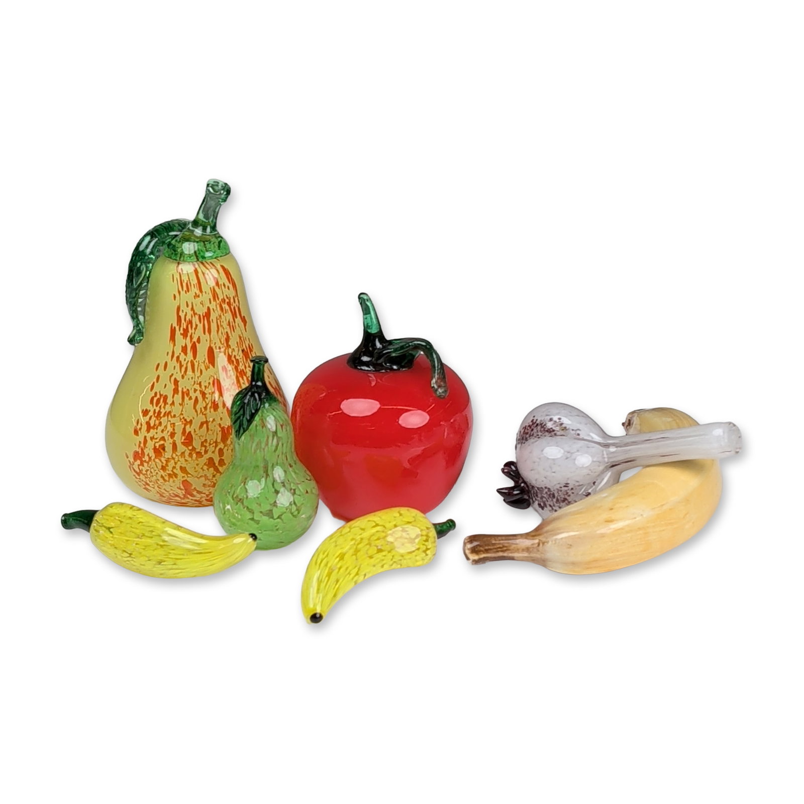 7pc Art Glass Fruit Figurines: Seven piece collection of hand-blown art glass decorative fruits and vegetables. Included items consist of a large banana with realistic terminal shading, a garlic bulb with internal mottling and appl