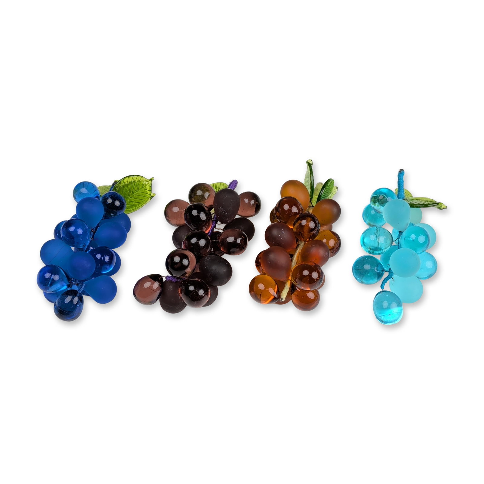 4pc Art Glass Grape Clusters: Decorative clusters featuring molded glass grape beads in varied transparent and frosted finishes, including cobalt blue, amethyst, amber, and turquoise. Each cluster includes two green glass leaves w
