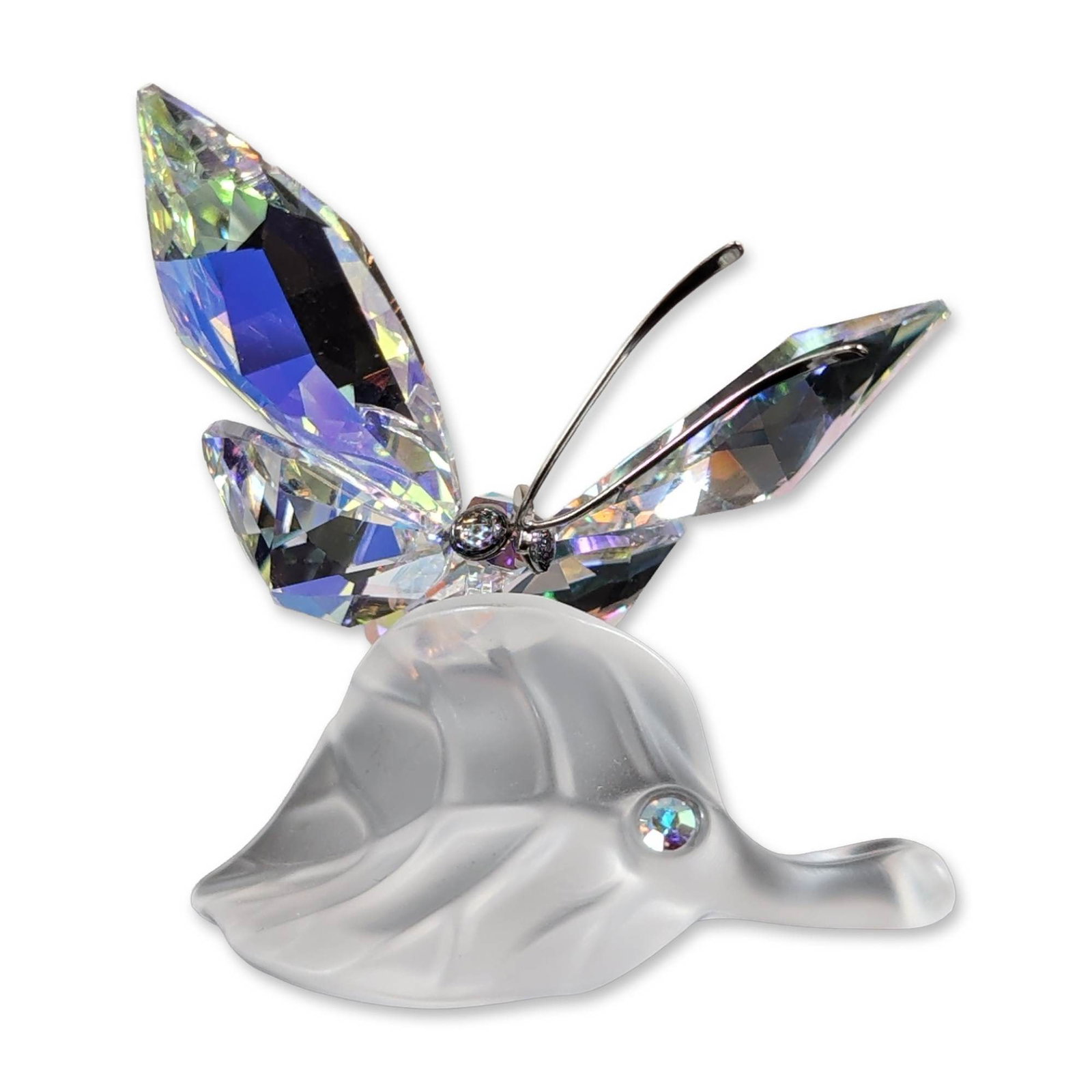 Swarovski Crystal Butterfly on Frosted Leaf Figurine: Decorative figurine featuring a faceted crystal butterfly with an Aurora Borealis finish perched on a molded frosted glass leaf base. The butterfly is detailed with fine metal antennae and a faceted b