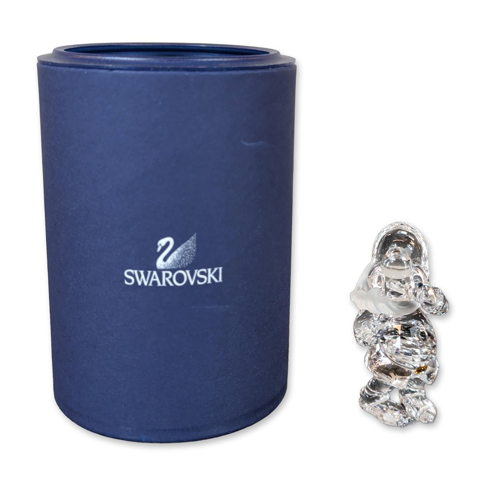 Swarovski Crystal Snow White Sneezy Dwarf Figurine: Swarovski crystal figurine, depicting the Sneezy Dwarf from Snow White and the Seven Dwarfs. The base is marked with the laser-etched Swarovski swan logo. Accompanied by original blue cylindrical bran