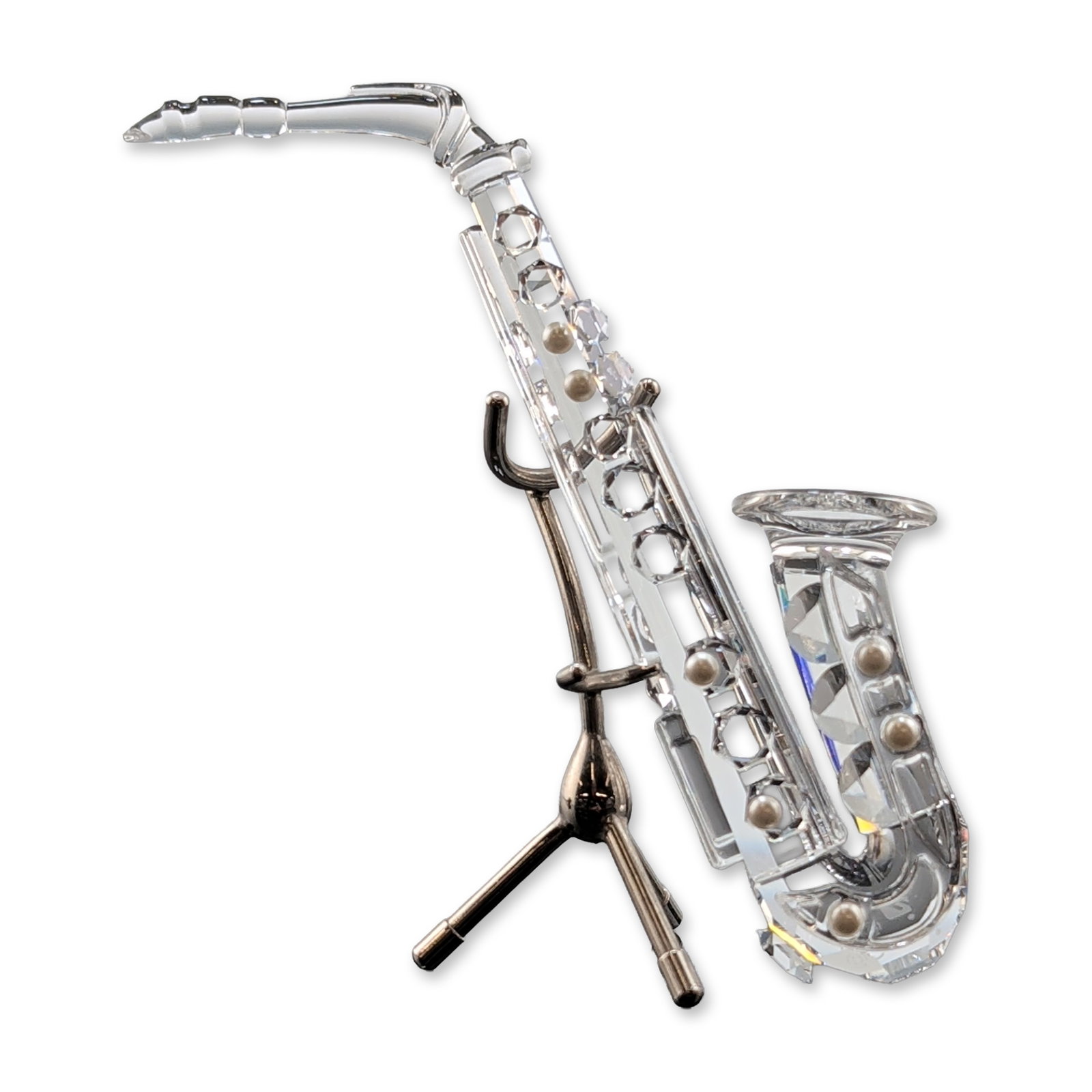 Swarovski Faceted Lead Crystal Saxophone Figurine with Stand: Swarovski Silver Crystal saxophone figurine, part of the Crystal Melodies series. This piece features a body, neck, and bell constructed from faceted clear lead crystal. It is accompanied by a separat
