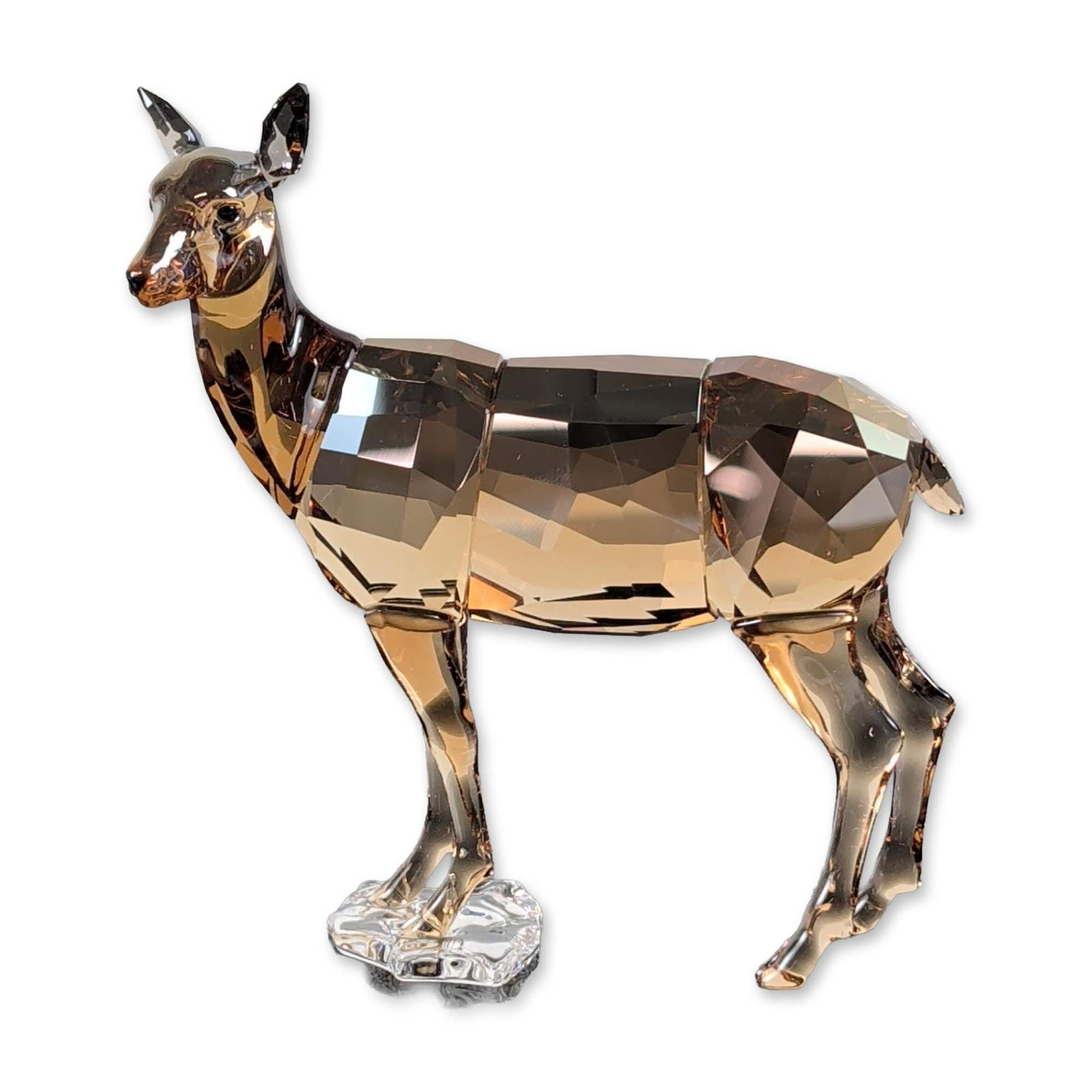 Swarovski SCS 2020 Annual Edition Crystal Doe: Swarovski Society (SCS) 2020 Annual Edition Doe figurine in Golden Shadow faceted lead crystal. The figure depicts a standing doe with faceted body and limbs, featuring a small clear crystal base supp