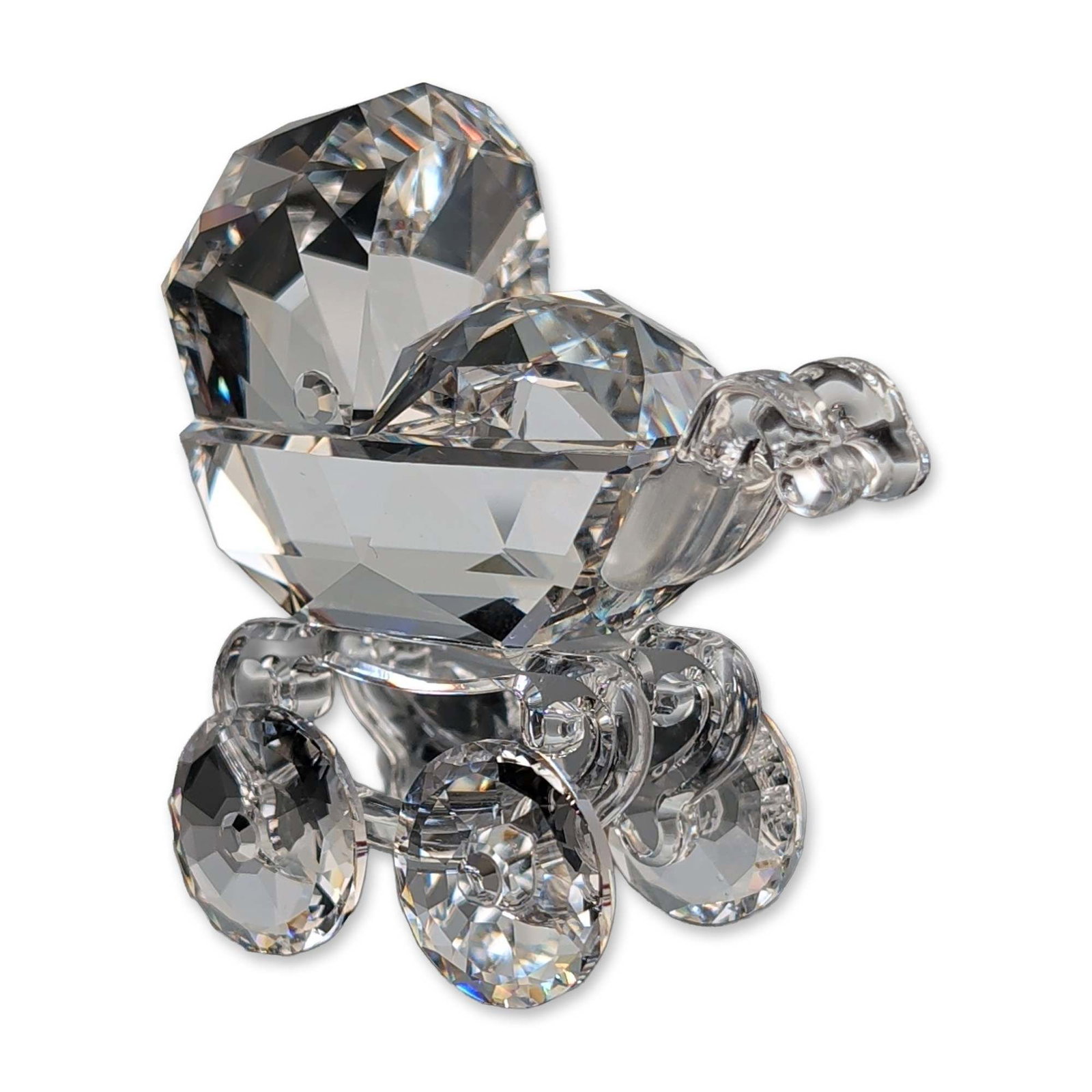 Swarovski Silver Crystal Baby Carriage: Swarovski crystal figurine depicting a miniature baby carriage or pram. Faceted clear lead crystal construction featuring a large faceted hood and four circular faceted wheels on polished crystal axle