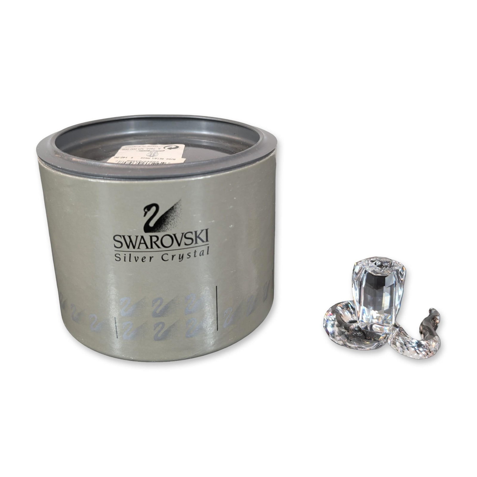 Swarovski Silver Crystal Cobra Snake Figurine: Swarovski Cobra snake figurine in faceted clear lead crystal from the Oriental Symbols series, featuring a coiled faceted body and integrated silver-tone metal tongue. Accompanied by its original cyli