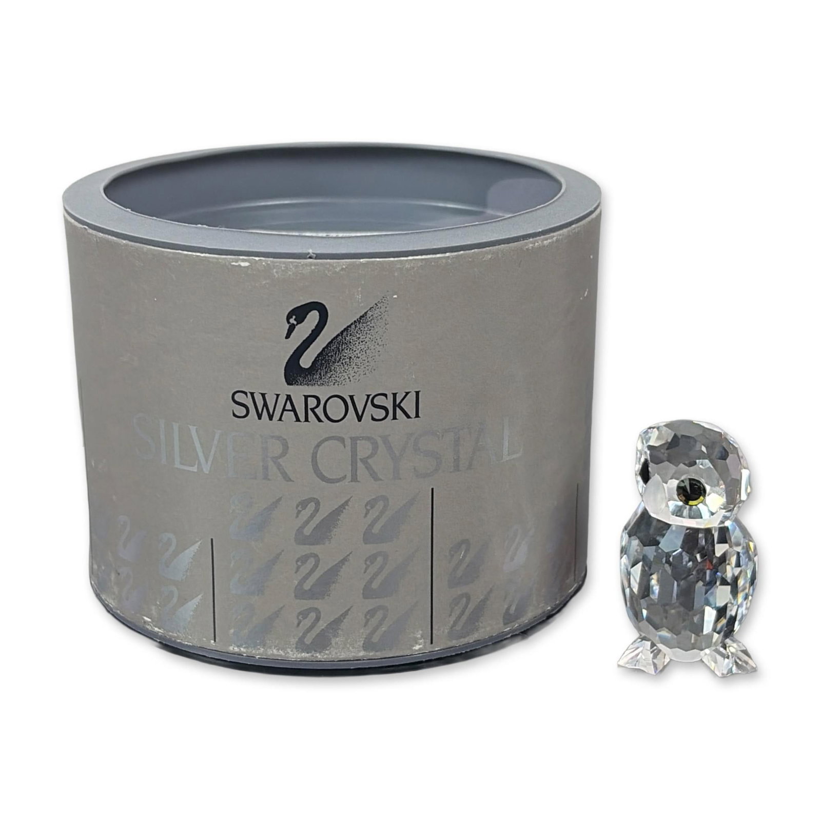 Swarovski Silver Crystal Owlet Figurine: This Swarovski crystal owlet, part of the Woodland Friends series, is crafted from clear crystal with a frosted beak and feet. It's signed with the initials of designer Anton Hirzinger and features th