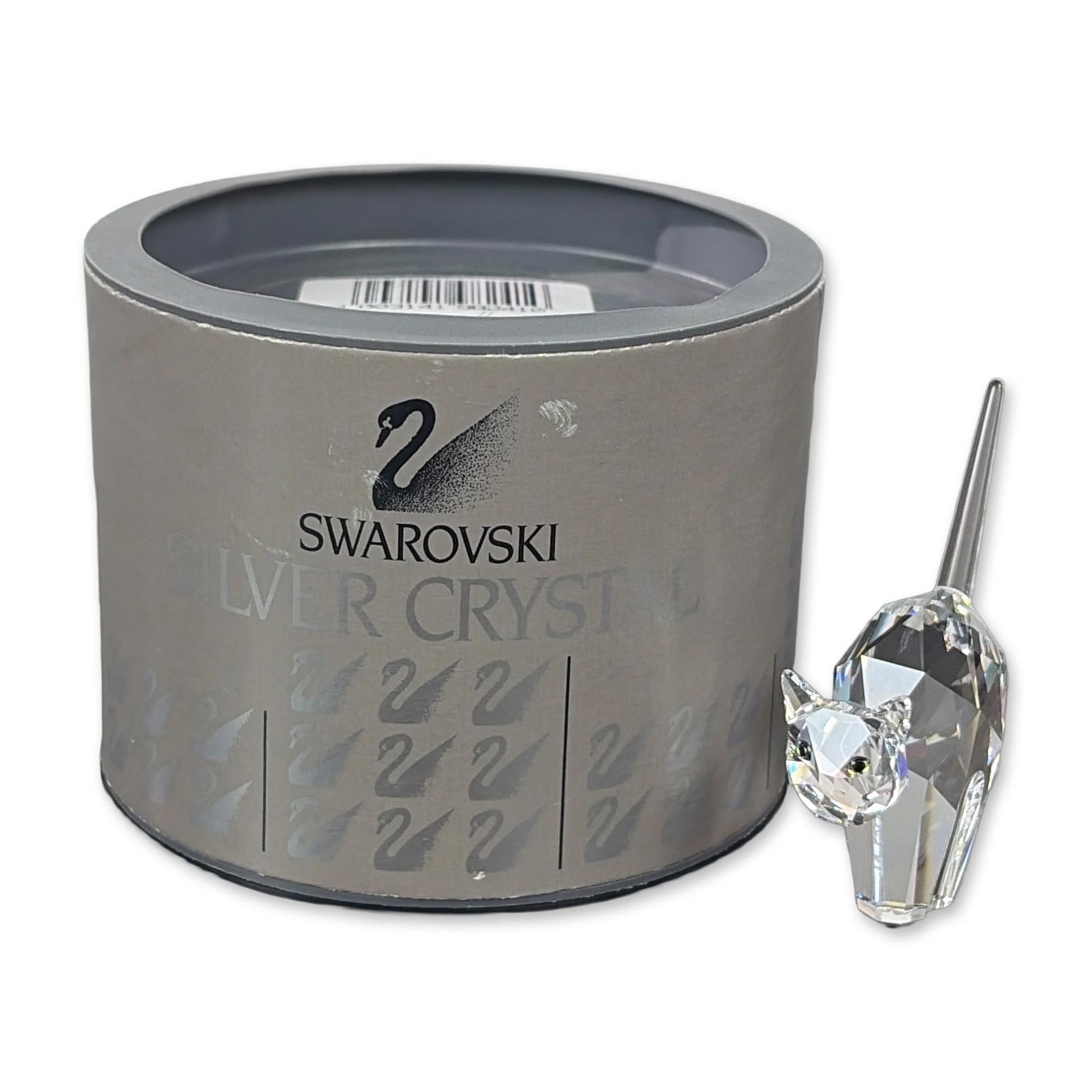 Swarovski Silver Crystal Tomcat Figurine: This striking cat figurine is crafted from clear crystal with piercing black eyes, perched high on a ridge in a fierce, angry stance. The base bears the etched signature of Anton Hirzinger, and it bel