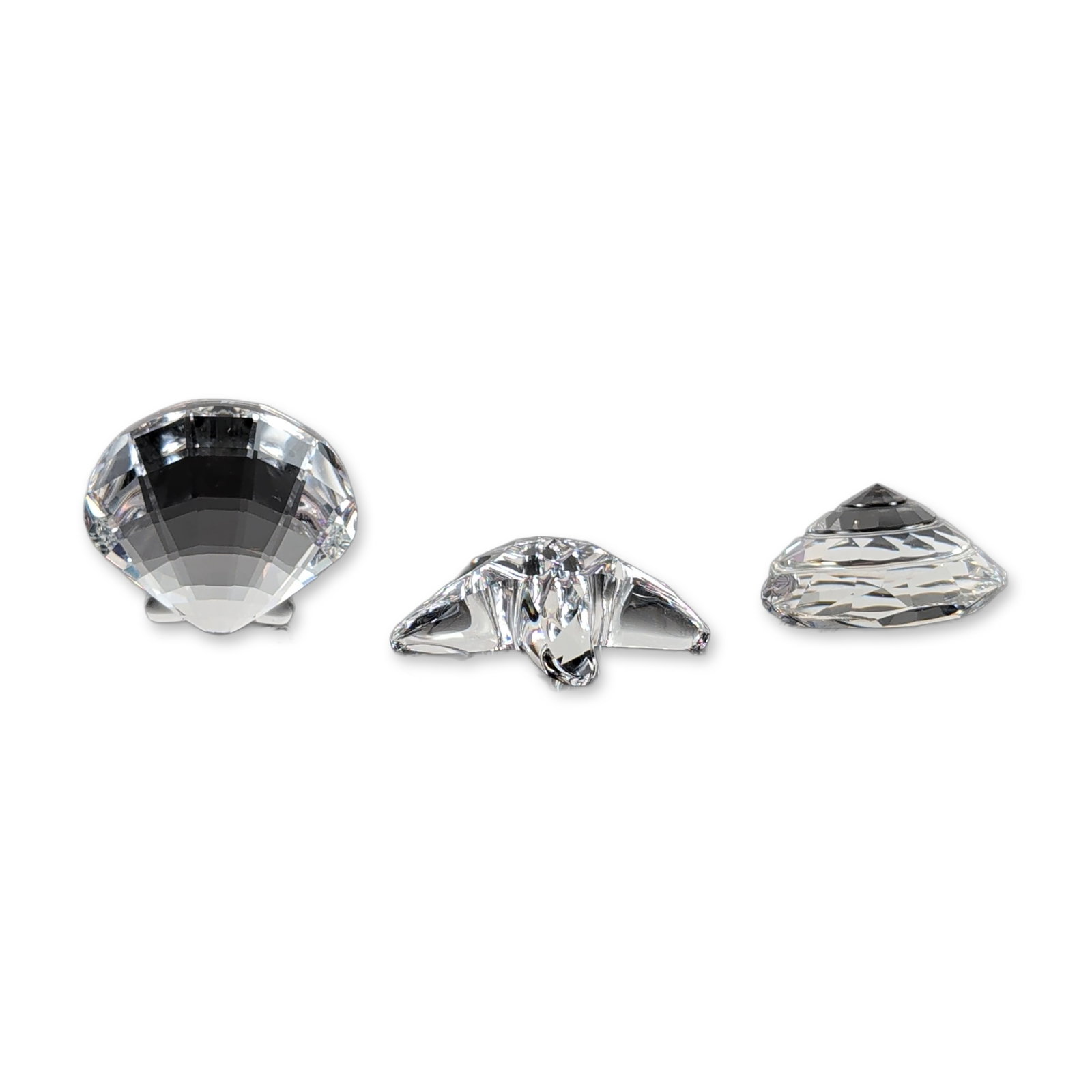 3pc Swarovski Marine Theme Crystal Figurines: Swarovski miniature faceted clear lead crystal figurines from the Silver Crystal collection with marine life subjects. Collection includes a five-pointed starfish with a precision-faceted top and flat