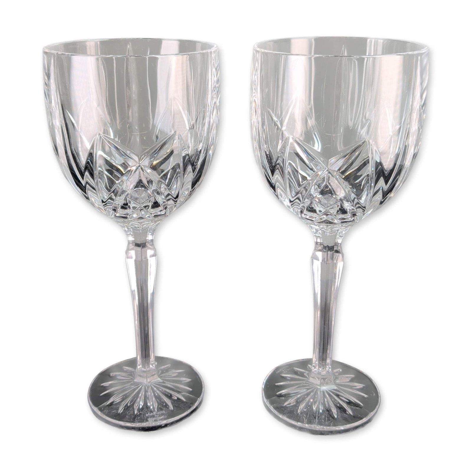 Pair of Waterford Marquis Brookside Crystal Water Goblets: Marquis by Waterford. Pair of lead crystal water goblets in the Brookside pattern, featuring bowls decorated with vertical wedge cuts over a deep crisscross diamond-cut band. The vessels are designed 