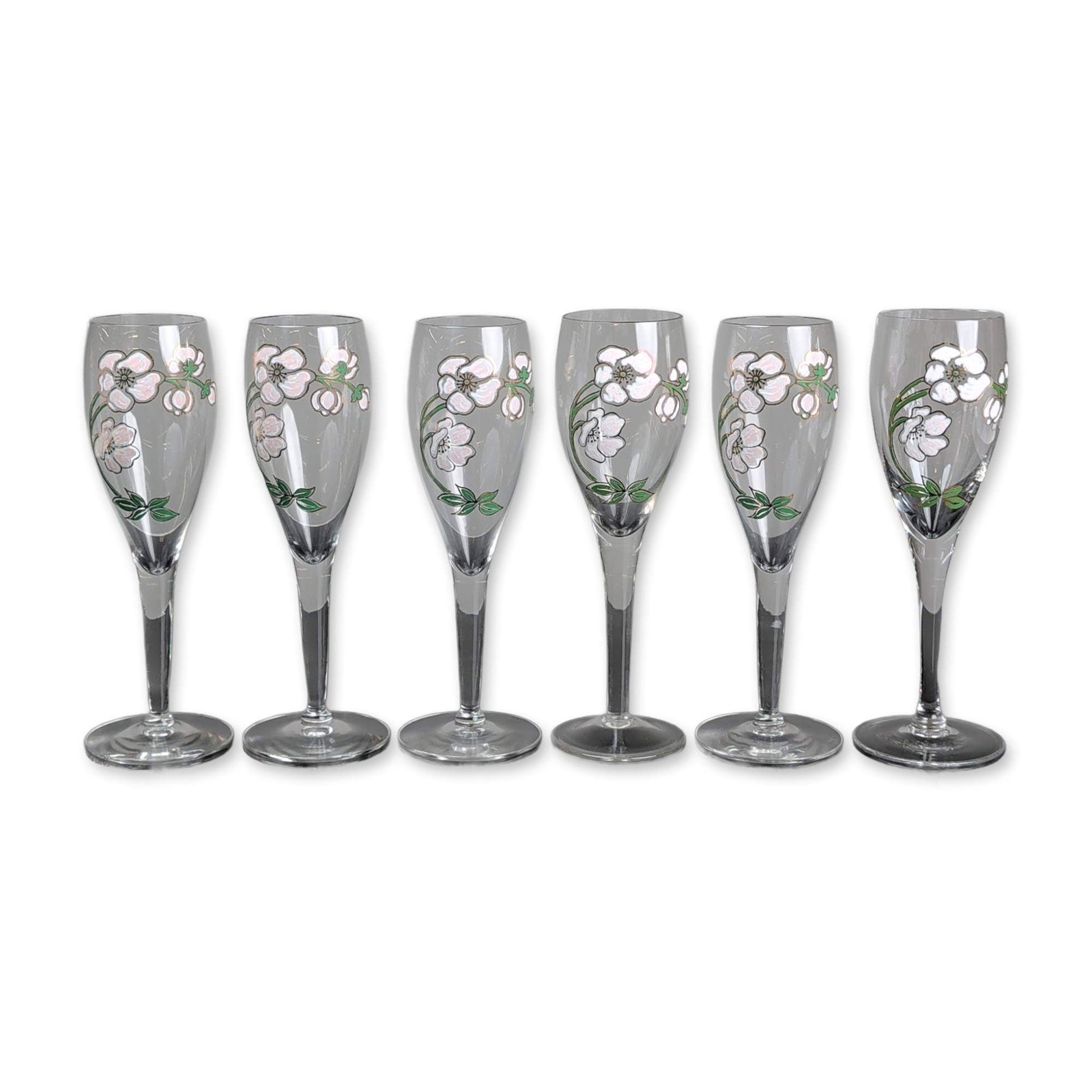 6pc Perrier-Jouet Belle Epoque Champagne Flutes: Perrier-Jouet. Set of six champagne flutes in clear blown glass, featuring the Belle Epoque anemone pattern. Each vessel is decorated with hand-painted enamel blossoms in shades of white and pale pink