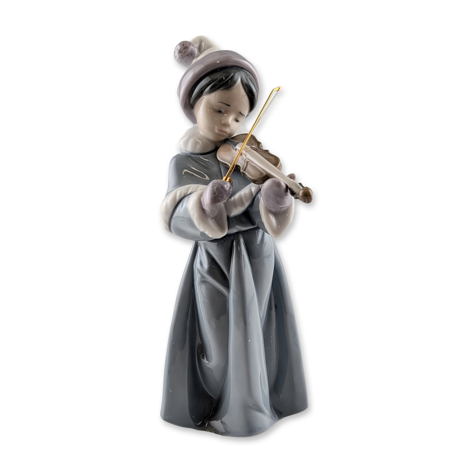 Lladro Spirit of Christmas Porcelain Figurine: Lladro glazed porcelain figurine titled The Spirit of Christmas, model number 6534. Sculpted by Juan Huerta, the figure depicts a young girl in winter attire, including a fur-trimmed coat, mittens, an
