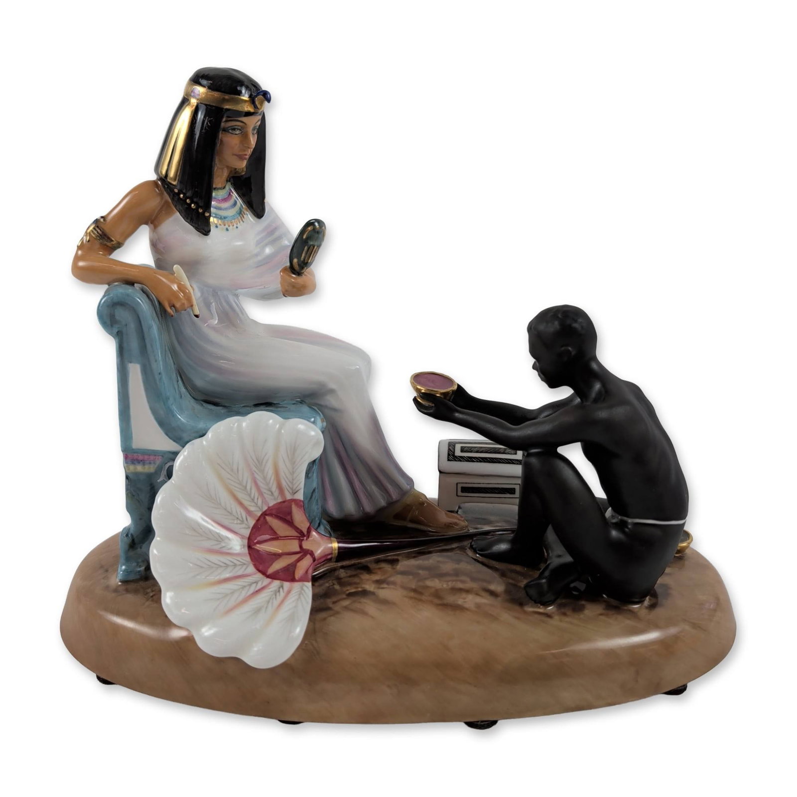 Royal Doulton Cleopatra Porcelain Figurine Group: Royal Doulton porcelain figurine group titled Cleopatra, HN 2868, from the Les Femmes Fatales series. Fine bone china construction featuring the Egyptian queen in an iridescent white gown and gold-acc