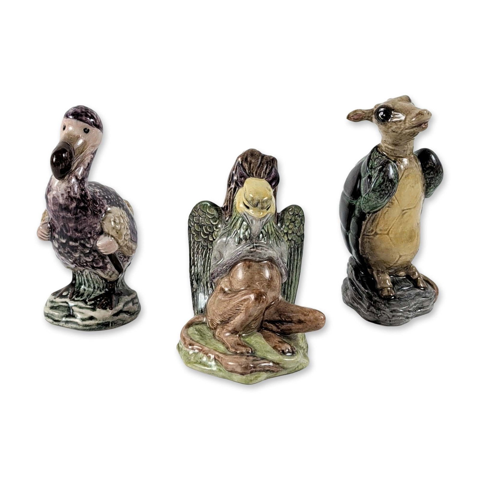 3pc Beswick Alice Series Ceramic Figurines: Beswick, England. Trio of glazed ceramic figurines from the Alice Series, depicting characters from Lewis Carroll's Alice's Adventures in Wonderland. The group includes the Mock Turtle, the Gryphon, a