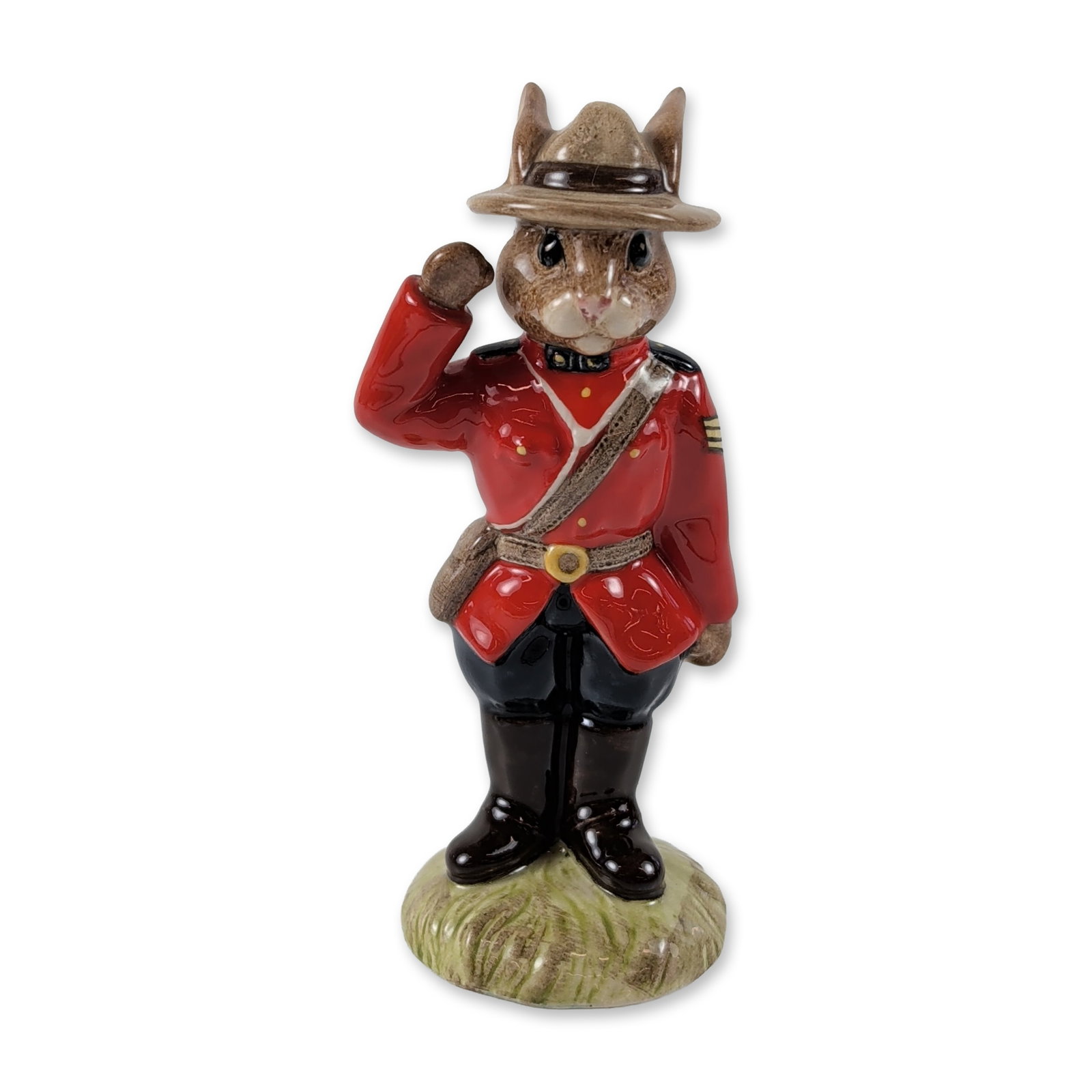 Royal Doulton Sergeant Mountie Bunnykins Figurine: Royal Doulton (England), 1993. Sergeant Mountie Bunnykins figurine in hand-painted glazed porcelain, model DB 136. The figure depicts a rabbit in Royal Canadian Mounted Police uniform with red serge t