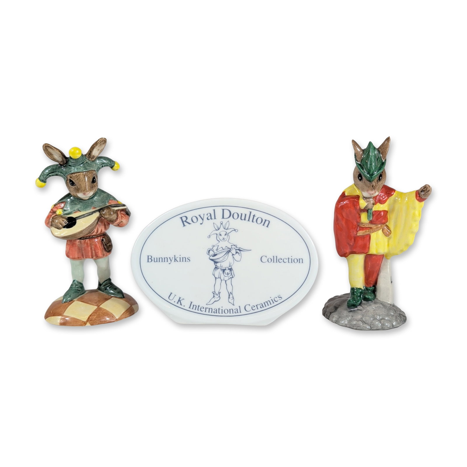 3pc Royal Doulton English Bunnykins Figurines: Royal Doulton, England. Trio of Bunnykins items in glazed ceramic and fine bone china, featuring medieval-themed rabbit characters. The set includes two limited edition figurines produced exclusively 