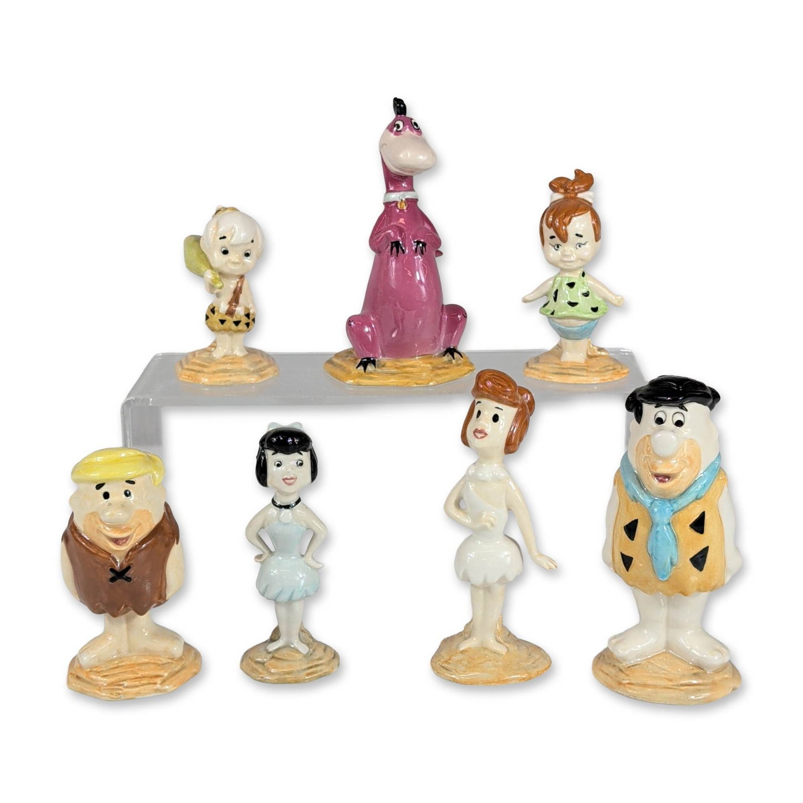 7pc John Beswick 1994 The Flintstones Ceramic Figurine Set: John Beswick for Collectors International Ltd. Seven piece collection of hand painted glazed ceramic figurines depicting the primary cast from the Hanna-Barbera animated series, The Flintstones. The s