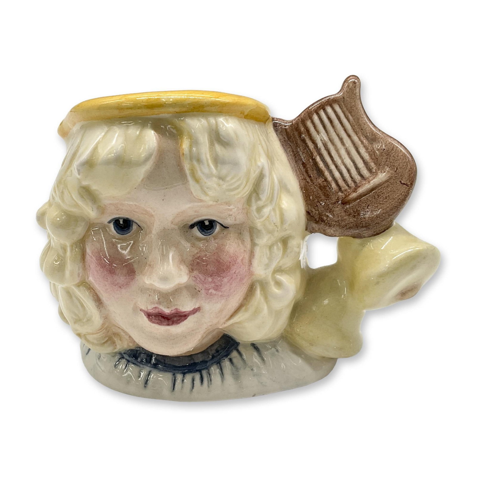 Angel D7051 - Mini - Royal Doulton Character Jug: White, light brown, and yellow coloration. Royal Doulton backstamp. Artist: Martyn C. R. Alcock Dimensions: 2.75"H Date or Era: 1996 - 1997 Manufacturer or Brand: Royal Doulton Country of Origin: