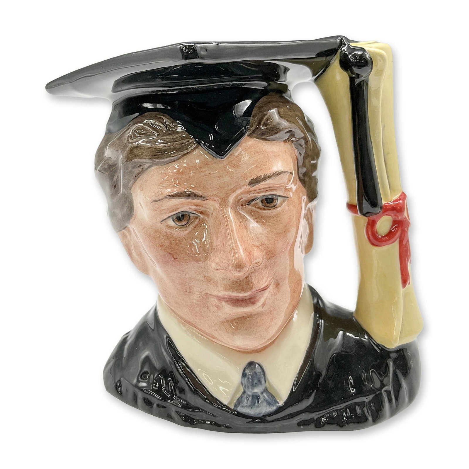 Graduate D6916 - Small - Royal Doulton Character Jug: Black and white coloration. Royal Doulton backstamp. Artist: Stanley J. Taylor Dimensions: 3.5"H Date or Era: 1991 - 1995 Manufacturer or Brand: Royal Doulton Country of Origin: England