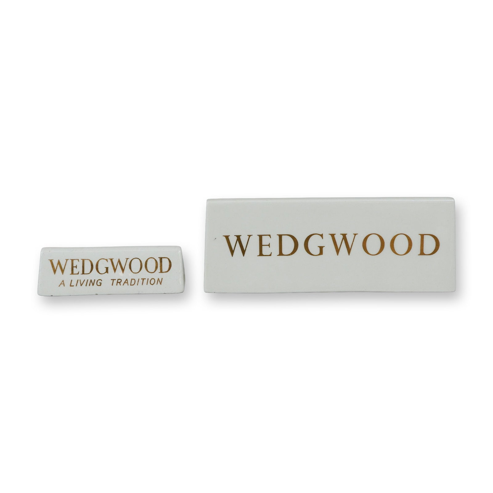 2pc Wedgwood Ceramic Dealer Display Plaques: This lot features a pair of vintage Wedgwood ceramic retail dealer display signs of varying sizes. Each plaque is constructed from glazed white earthenware in a hollow-cast, wedge-shaped form designed