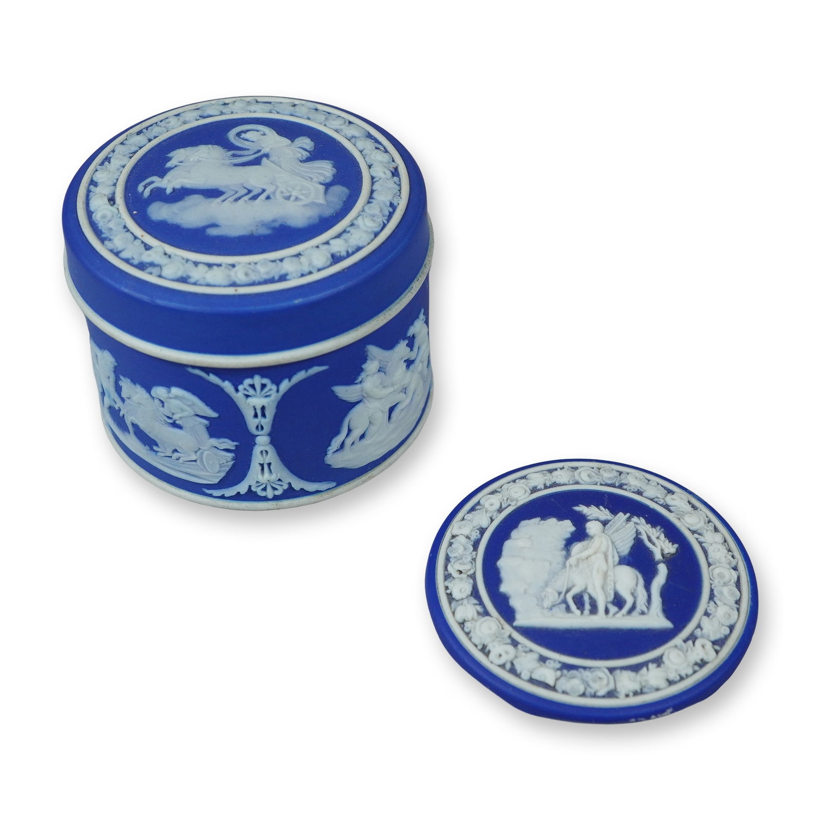 3pc Wedgwood Jasperware Blue and White Cylindrical Trinket Box & Disc: This three-piece set of blue and white Jasperware consists of a cylindrical trinket box, a deep-flanged primary lid, and a secondary flat disc lid. The components are constructed from cobalt blue ston