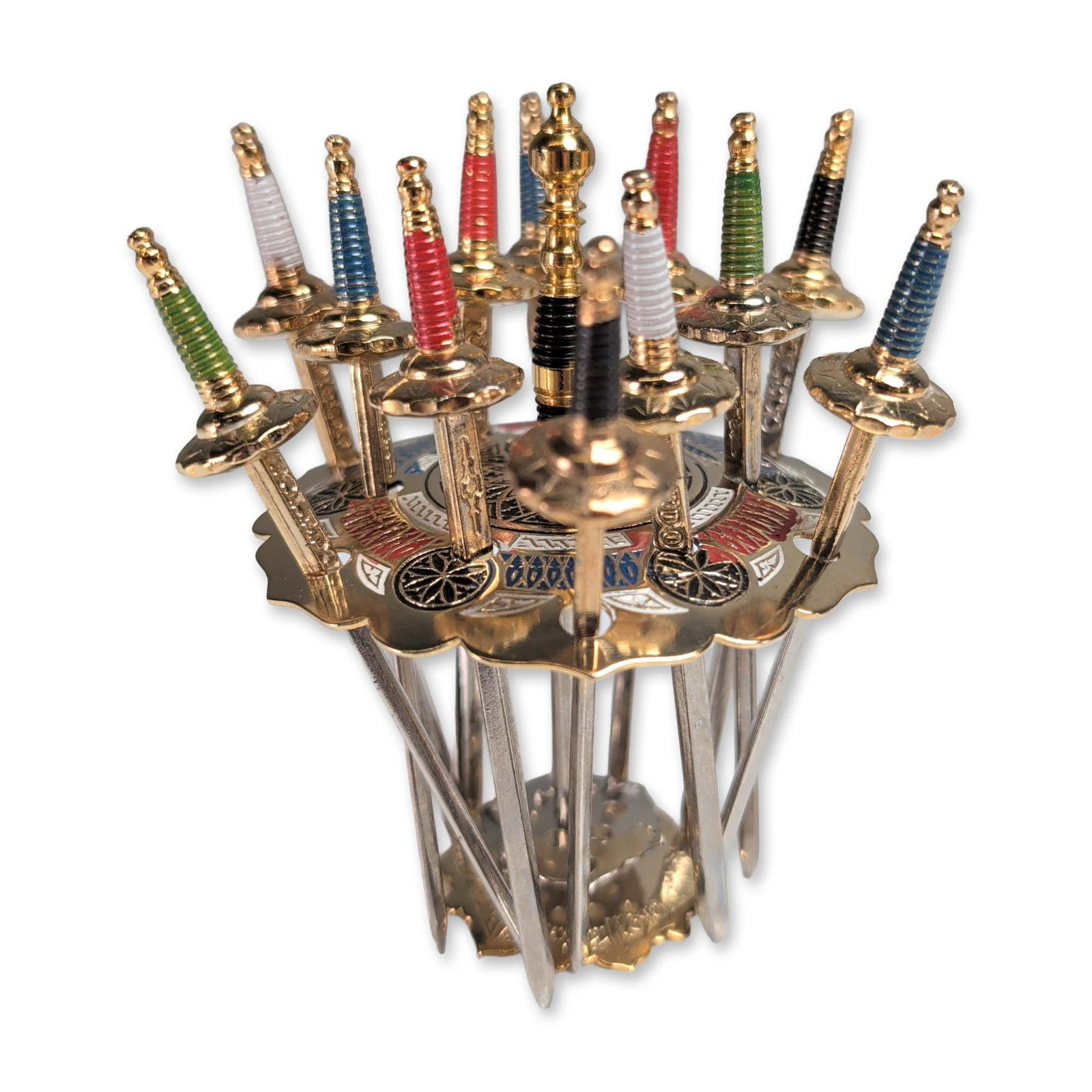 Toledo Spanish Gilt Miniature Sword Cocktail Set: Spanish, mid-20th century. Cocktail pick set in gilt-finished metal, featuring twelve miniature swords modeled after traditional rapiers. Each pick includes a circular guard with decorative scrollwork