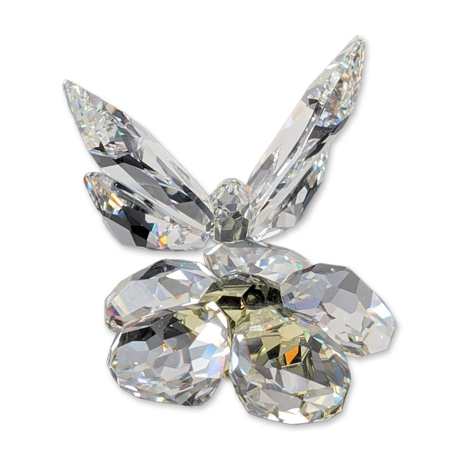 Swarovski Crystal Butterfly on Flower Figurine: This Swarovski crystal Butterfly on Flower figurine is crafted from faceted lead crystal, showcasing a clear butterfly perched on a flower with clear petals and a pale yellow crystal center. The centr