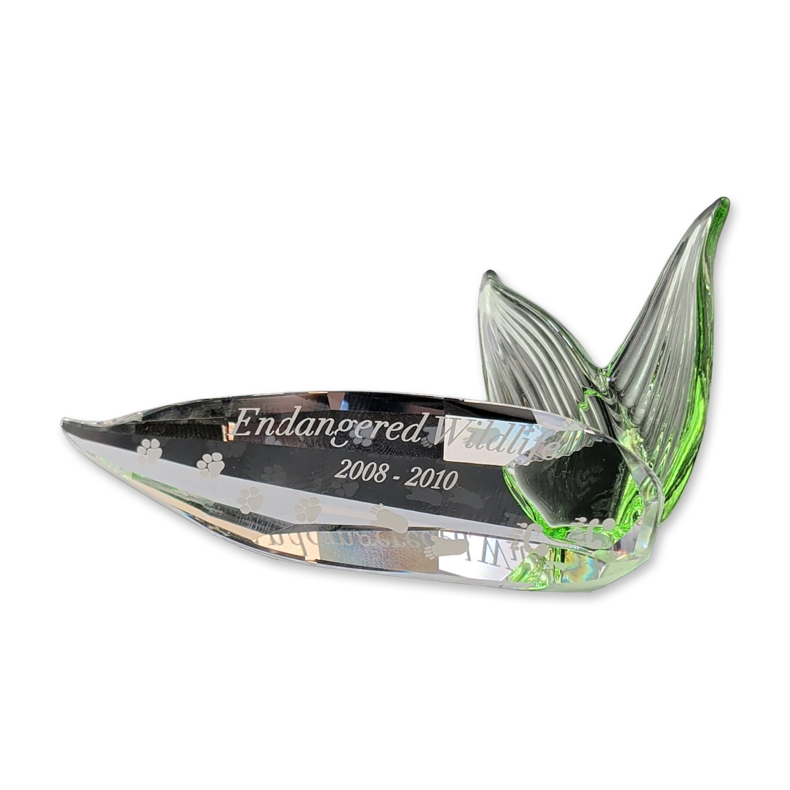 Swarovski Crystal Endangered Wildlife Trilogy Title Plaque: Swarovski Crystal Society (SCS) Endangered Wildlife commemorative title plaque, designed for the 2008-2010 trilogy. Composed of clear and green faceted lead crystal, the piece features two clear leave