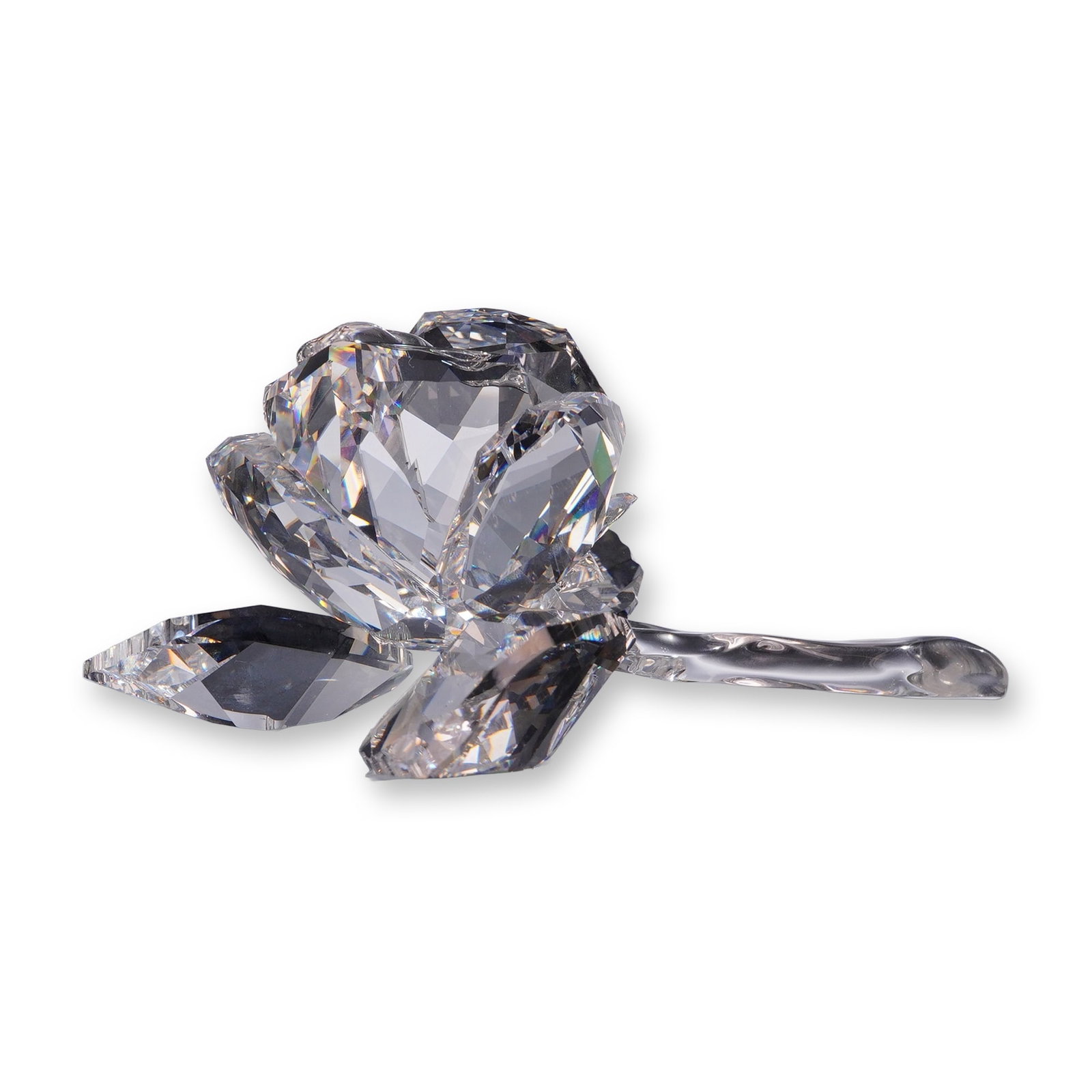 Swarovski Crystal Figurine, Rose Blossom: Rose blossom figurine in faceted clear crystal, featuring a detailed rose head in bloom attached to a smooth curved stem with three faceted leaves. Marked with an acid-etched Swarovski swan logo and
