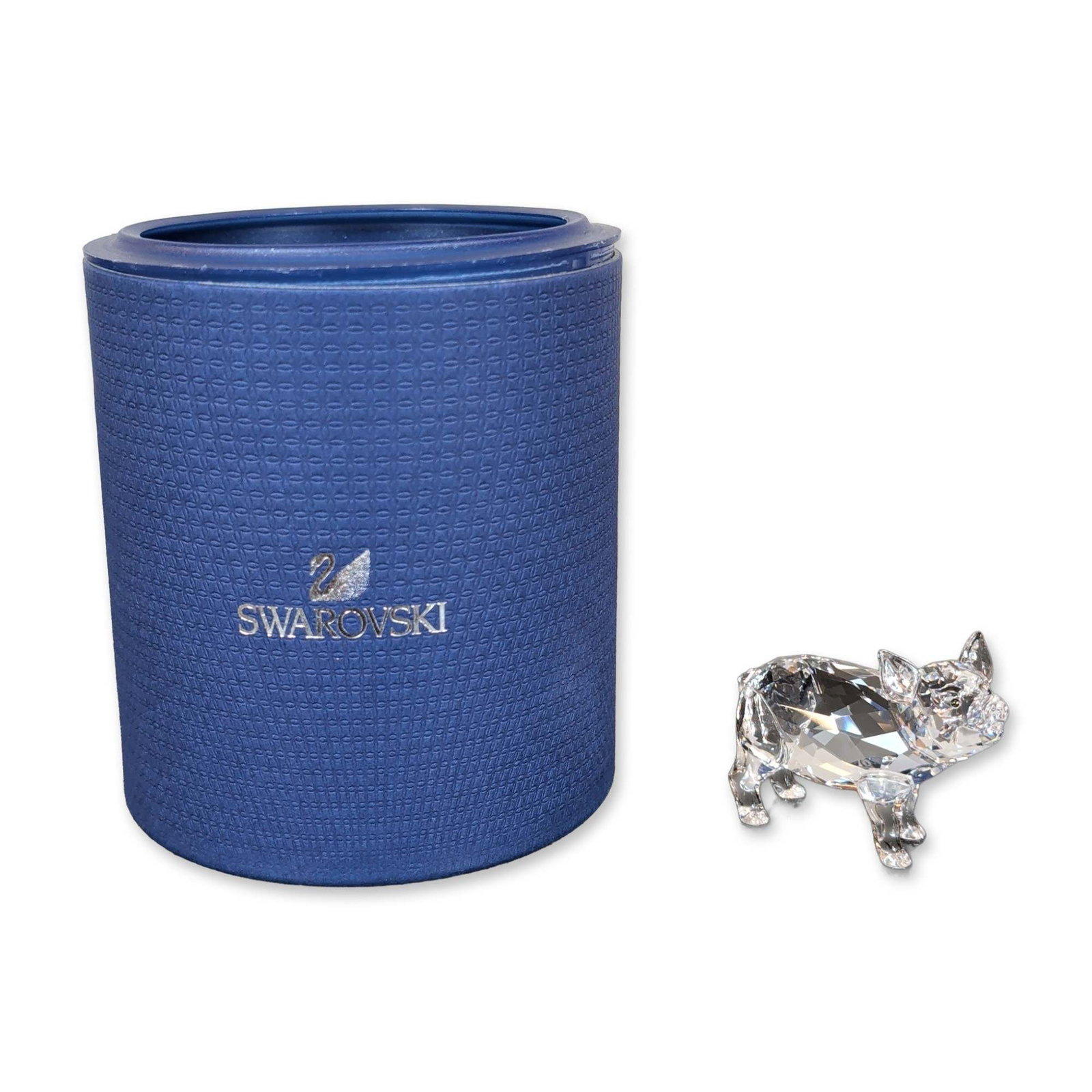 Swarovski Crystal Piglet Figurine: Swarovski crystal figurine, titled Piglet, constructed of clear faceted lead crystal in the form of a standing pig. The figurine is etched with the Swarovski swan logo and copyright symbol on the