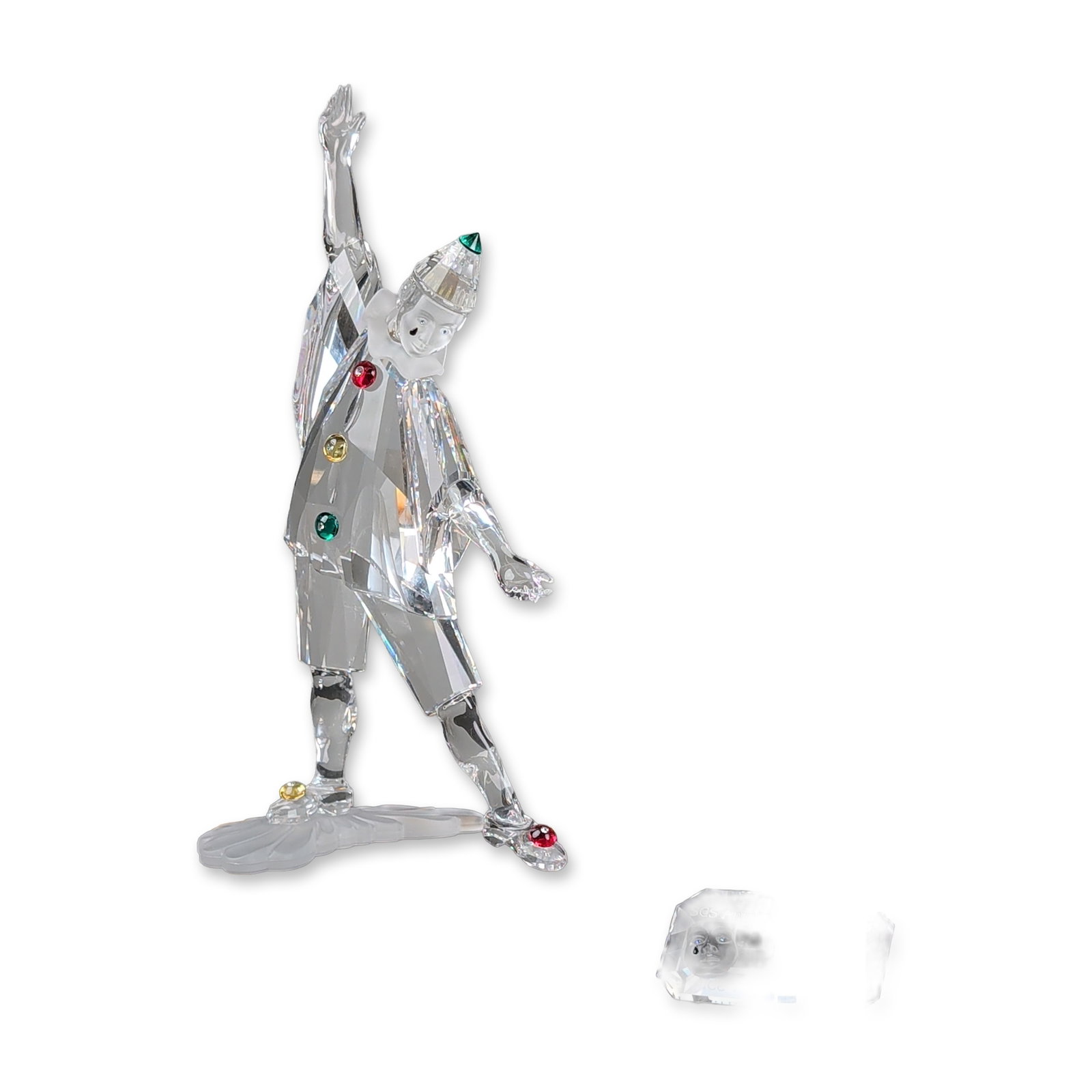 Swarovski Crystal SCS 1999 Annual Edition Figurine, Plaque and Base, Pierrot: Swarovski SCS 1999 Annual Edition Pierrot figurine designed by Adi Stocker. The faceted lead crystal figure features frosted crystal face and hand elements, accented with red, yellow, and green crysta
