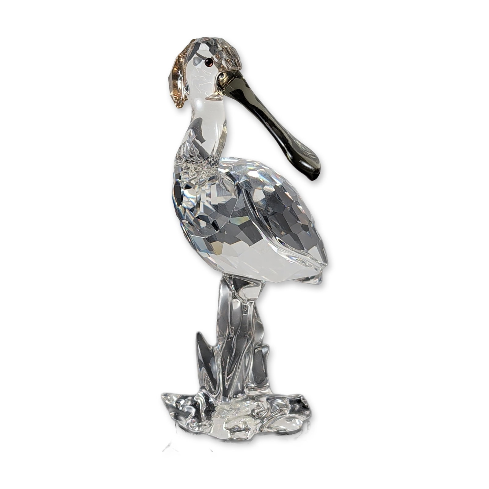 Swarovski Crystal Spoonbill Bird Figurine: Swarovski crystal figurine of a spoonbill, model number 931746, from the Feathered Beauties collection. The multifaceted crystal figure features a clear body, a smoke-colored beak, and a topaz-colored