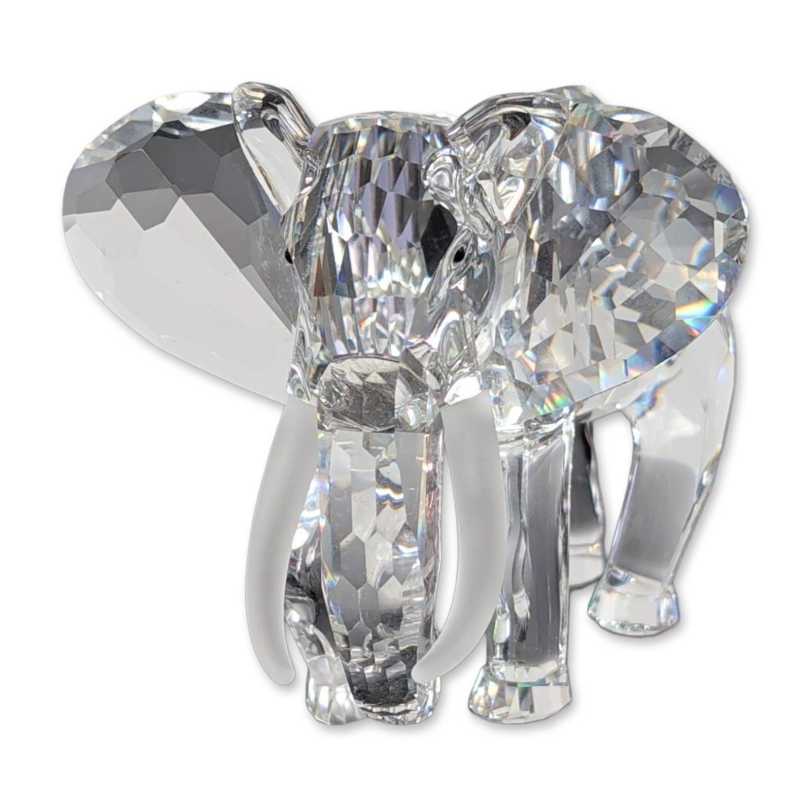 Swarovski SCS 1993 Inspiration Africa Crystal Elephant Figurine: This 1993 Swarovski Crystal Society (SCS) Annual Edition "Elephant" is the first piece from the "Inspiration Africa" trilogy. Designed by Martin Zendron, the figurine is crafted from clear faceted cry