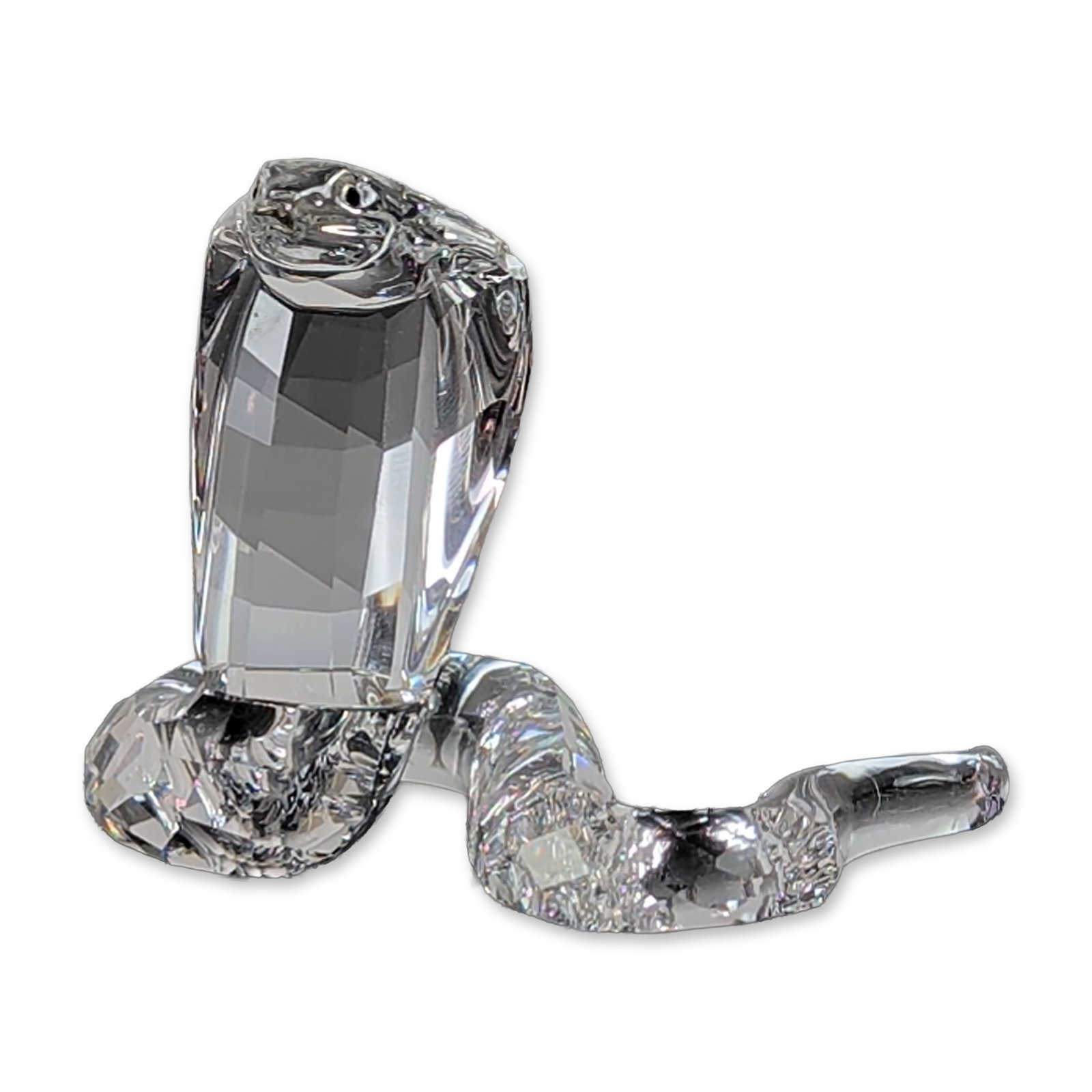 Swarovski Silver Crystal Cobra Figurine: Swarovski Silver Crystal. Cobra figurine in faceted clear lead crystal, featuring a coiled upright posture with precision-cut facets on the head and body. Marked with the etched Swarovski swan logo on