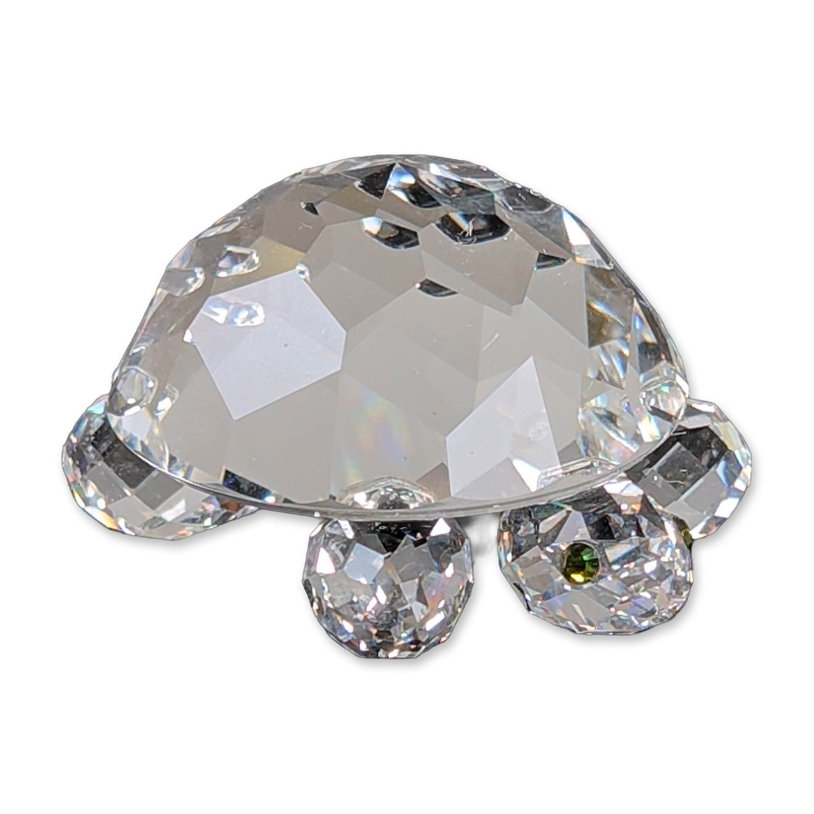 Swarovski Silver Crystal Figurine, Large Turtle: Swarovski Silver Crystal turtle figurine crafted from faceted clear lead crystal. The piece features a stylized faceted shell, four faceted legs, and a faceted head with two green crystal chaton eyes.