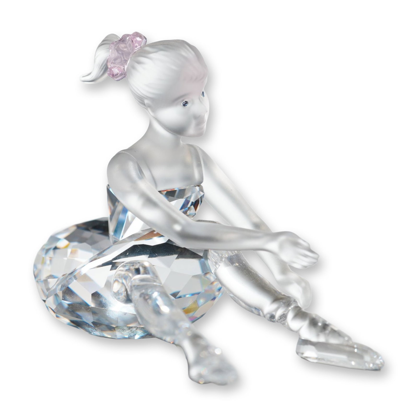 Swarovski Silver Crystal Figurine, Young Ballerina: Swarovski Silver Crystal seated Young Ballerina figurine crafted from lead crystal, the figure features a frosted satin-finished body and limbs with a voluminous faceted clear crystal tutu. Design inc