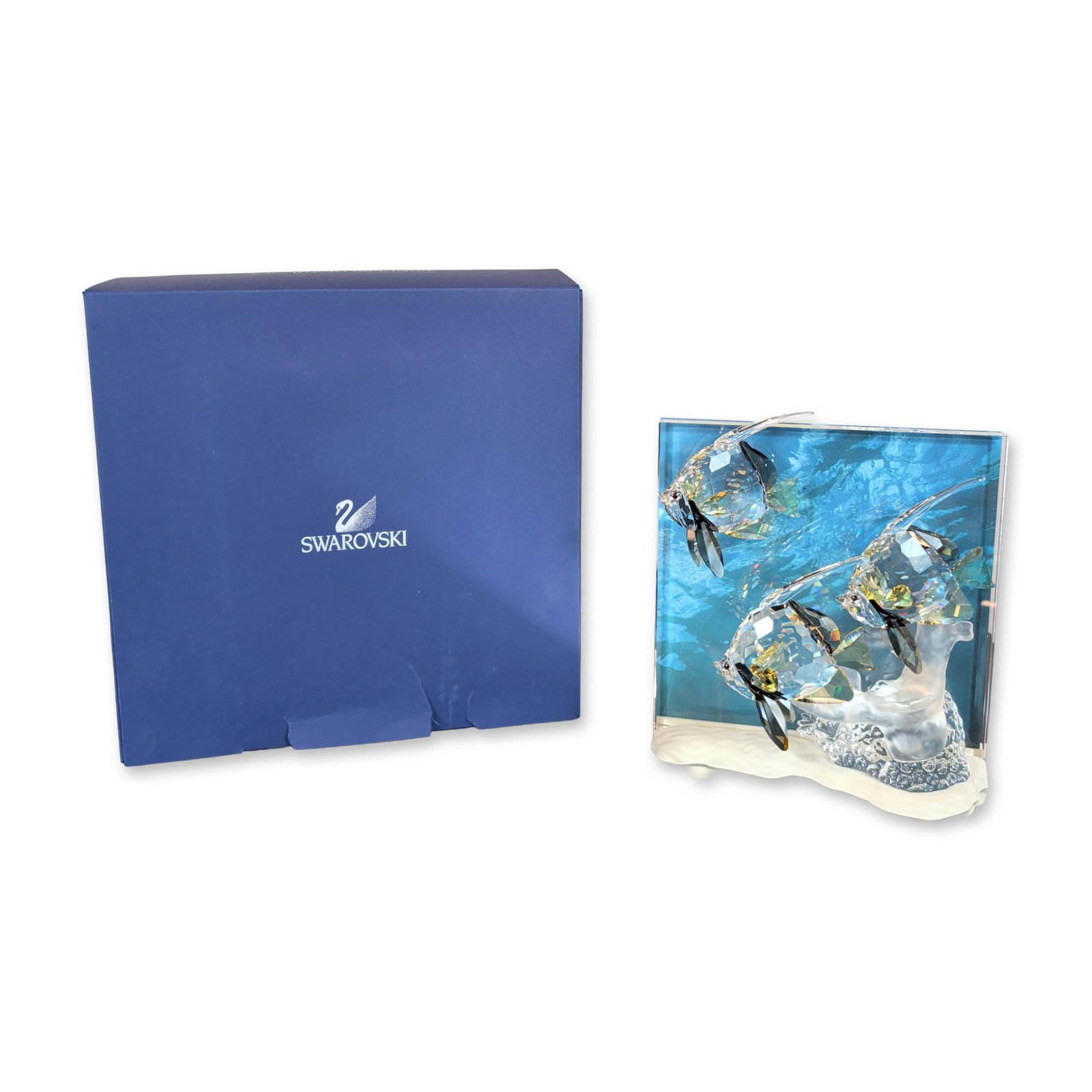 Swarovski Wonders of the Sea Community Figurine: Swarovski Crystal figurine titled Community, representing the third and final installment in the Wonders of the Sea trilogy. The piece features three faceted clear crystal fish with yellow and black a