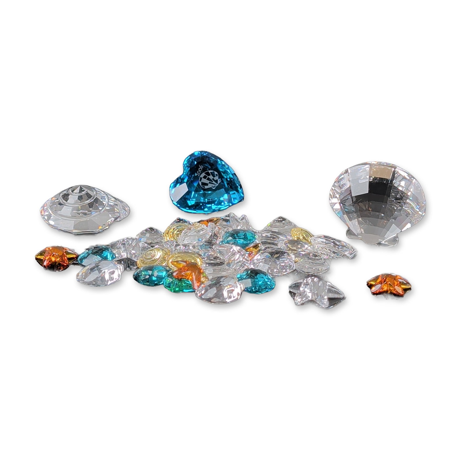 3pc Collection of Swarovski Faceted Crystals: Collection of Swarovski faceted crystal components in diverse geometric shapes, including stars and hearts. Features the Swarovski Crystal Society (SCS) 2006 Eternity membership heart in blue crystal,