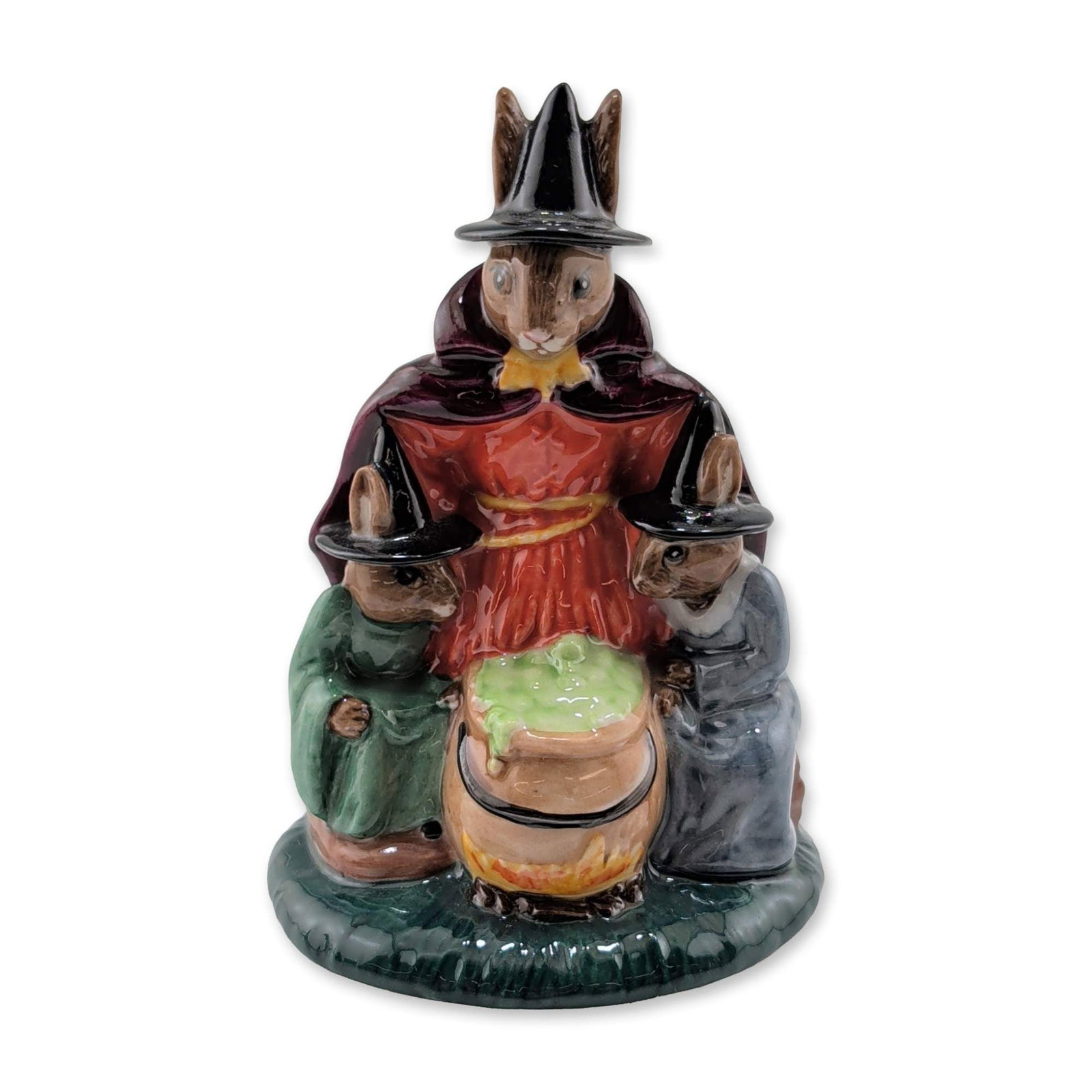 Royal Doulton Bunnykins Ceramic Colorway Figurine, Witches Cauldron DB 293: Royal Doulton. Witches Cauldron Bunnykins figurine, model DB 293, in polychrome glazed ceramic. The hand-made and hand-decorated piece depicts three rabbits in hats and cloaks surrounding a cauldron o