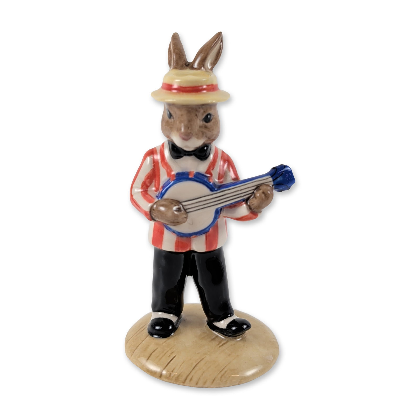 Royal Doulton Banjo Player Bunnykins Figurine DB182: Royal Doulton Bunnykins figurine titled Banjo Player Bunnykins, model DB 182, from the Jazz Band Collection. The glazed ceramic figure depicts a rabbit wearing a red and white striped jacket, black bo
