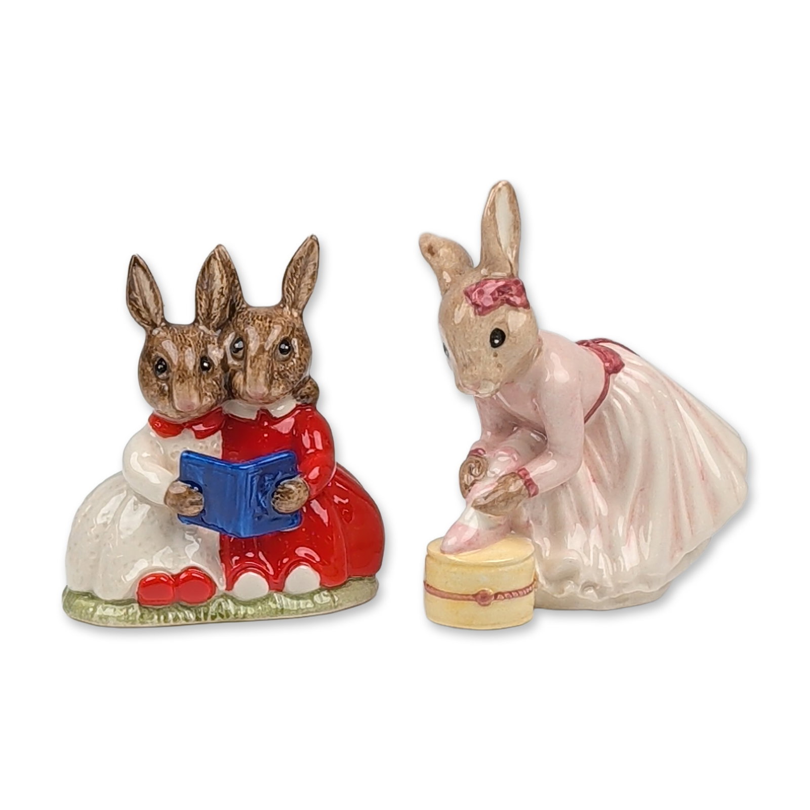 2pc Royal Doulton Bunnykins Figurines: Pair of glazed ceramic figurines featuring characters from children's literature by Beswick and Royal Doulton. The first figurine, Ballerina Bunnykins DB176, depicts a rabbit character wearing a pink 