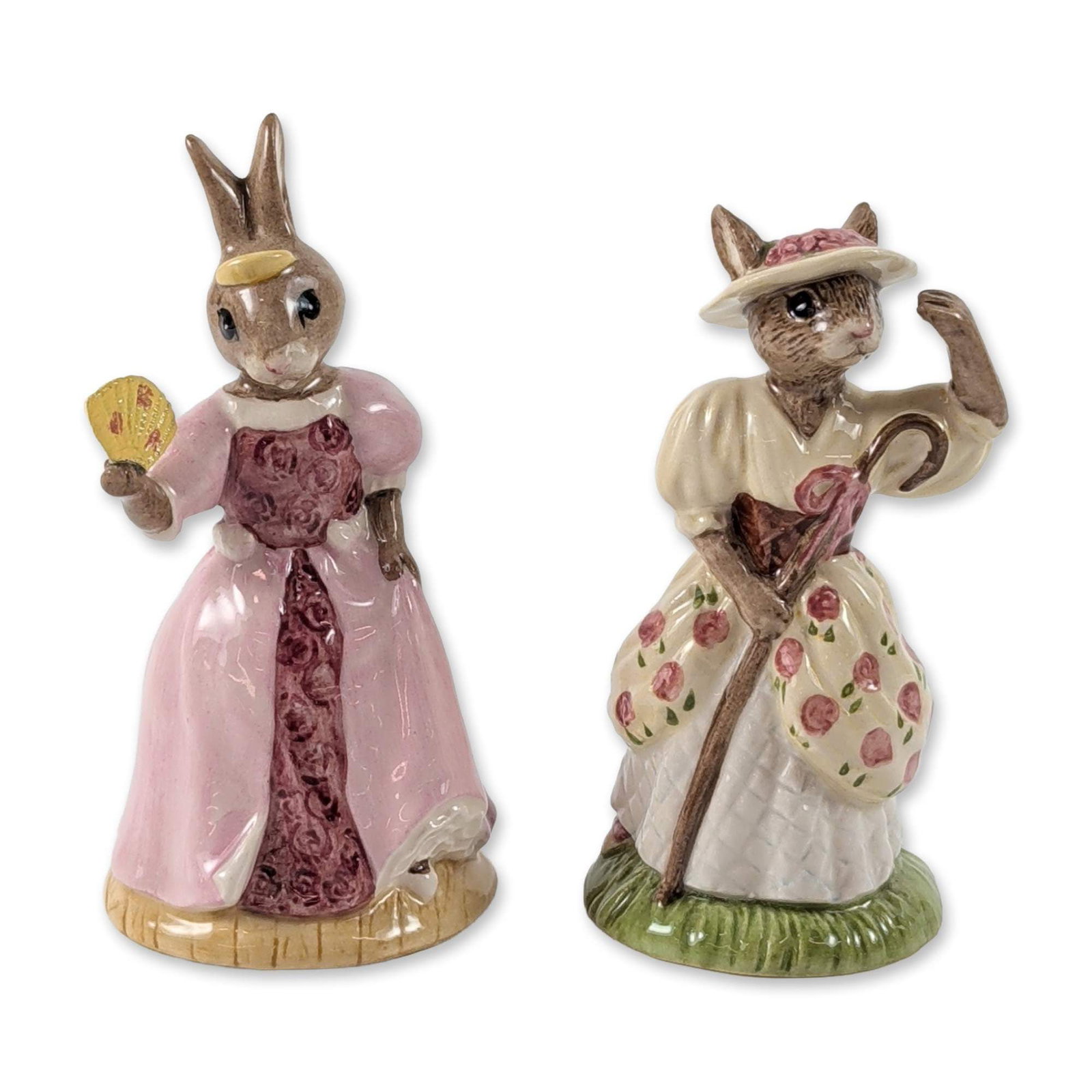 2pc Royal Doulton Bunnykins Porcelain Figurines: Royal Doulton. Pair of Bunnykins series glazed porcelain figurines, including Cinderella (DB 231) and Little Bo Peep (DB 220). Cinderella features a rabbit dressed in a pink ballgown with a patterned 