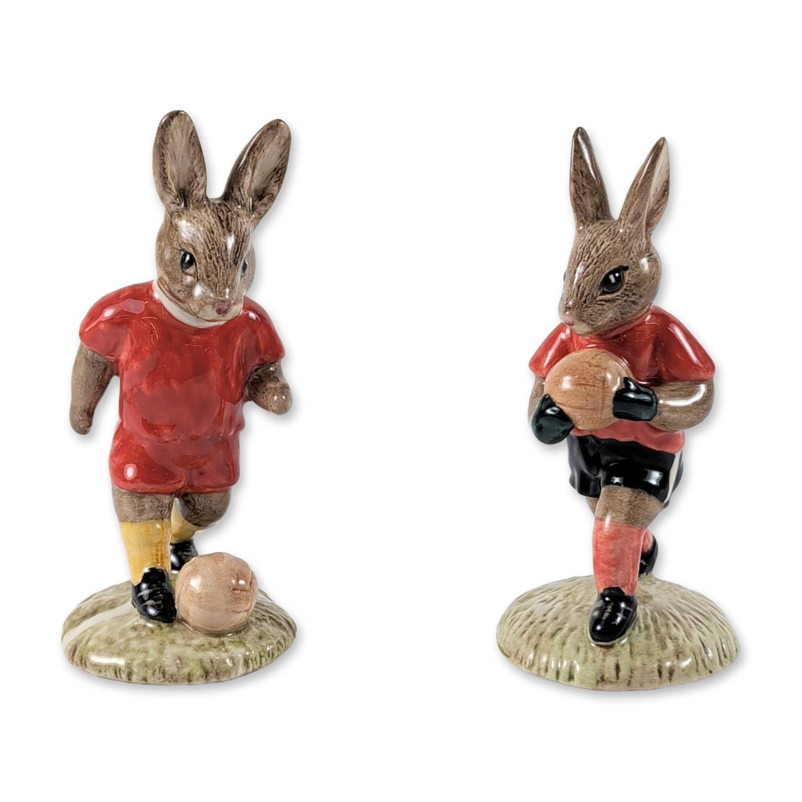 2pc Royal Doulton Soccer Bunnykins Figurines: Royal Doulton (British, late 20th century). Pair of limited edition ceramic figurines from the Bunnykins series, featuring soccer-themed rabbit characters. The set consists of Goalkeeper (DB 118) and 