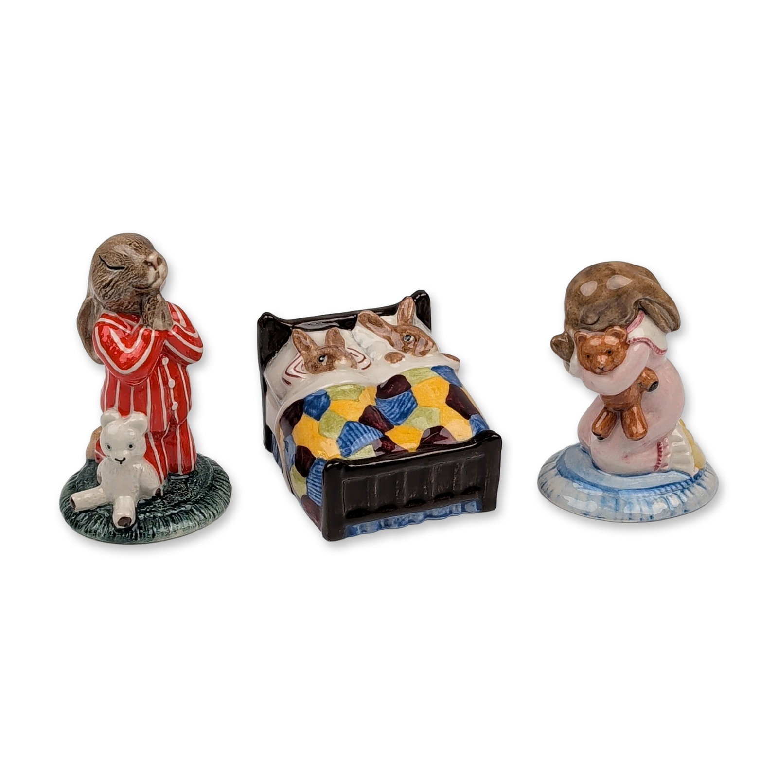 3pc Royal Doulton Bunnykins Ceramic Figurine: Royal Doulton. Group of three Bunnykins series figurines in glazed ceramic, featuring various bedtime-themed rabbit characters. The assortment includes Sleepytime (DB 15) featuring two rabbits tucked 
