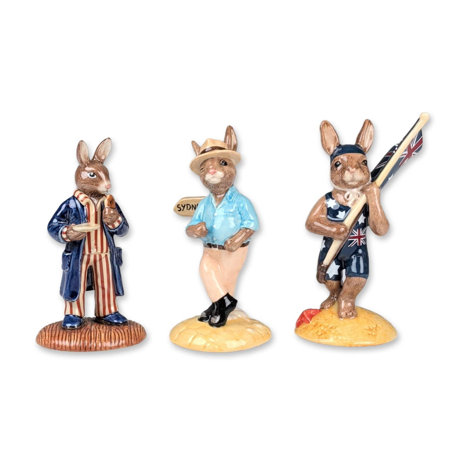 3pc Royal Doulton Limited Edition Bunnykins Figurines: Trio of Royal Doulton Bunnykins figurines in glazed ceramic, featuring various commemorative and national themes. All items feature the Royal Doulton lion and crown backstamp. Dimensions: 2.75"W x 4.7