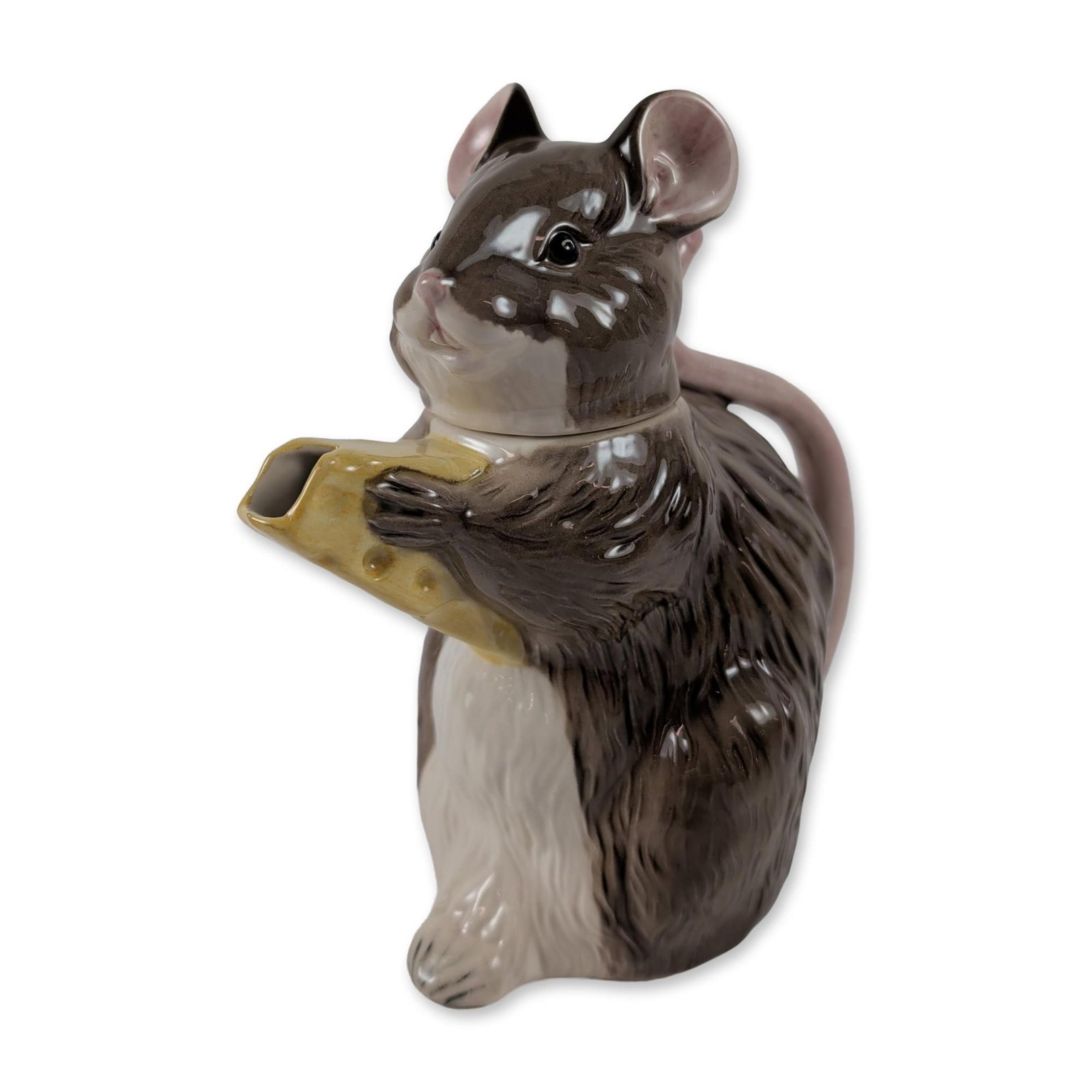 Beswick Figural Ceramic Mouse Teapot: Beswick figural novelty teapot in glazed earthenware, modeled as a seated mouse holding a wedge of yellow cheese. The cheese serves as the spout, the pink tail forms the handle, and the mouse head act