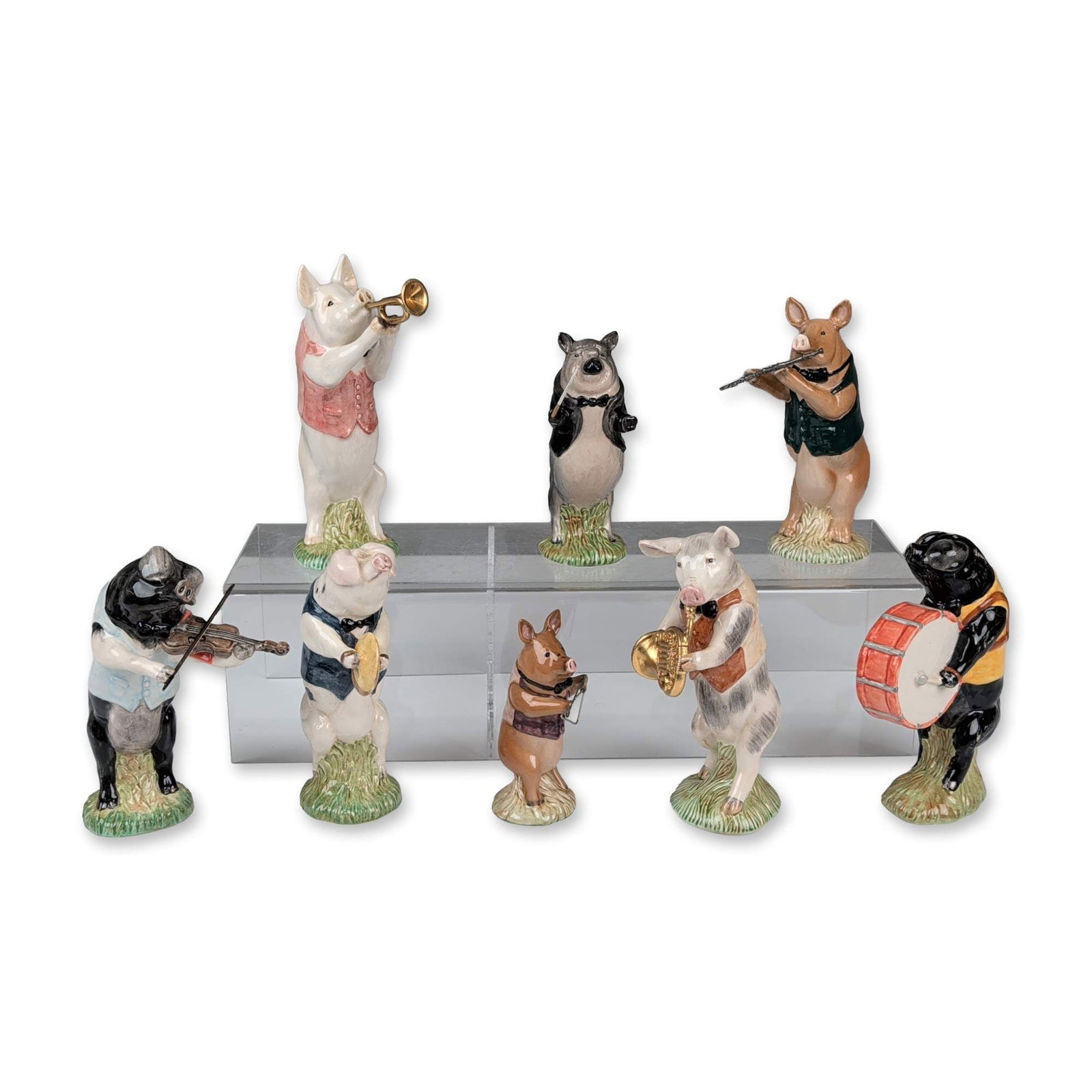 8pc Beswick Pig Promenade Figurine Set: Beswick Ware. Set of eight anthropomorphic musical pig figurines from the Pig Promenade series in glazed polychrome ceramic. Each figure is modeled in formal dress playing a gold-colored or painted in